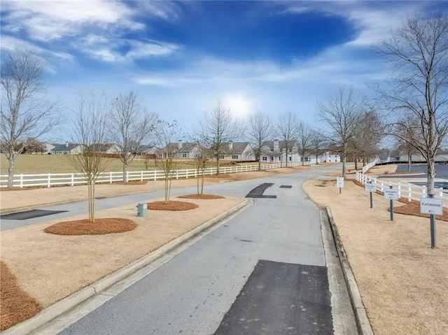a kitchen with kitchen island a sink appliances and a counter top space