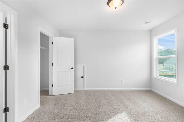 a view of a livingroom and a hallway
