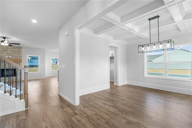 a view of kitchen with sink and refrigerator