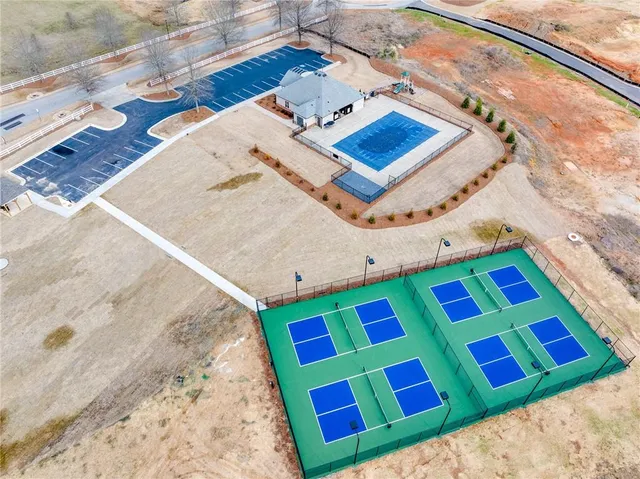 a view of a yard covered with snow in the background