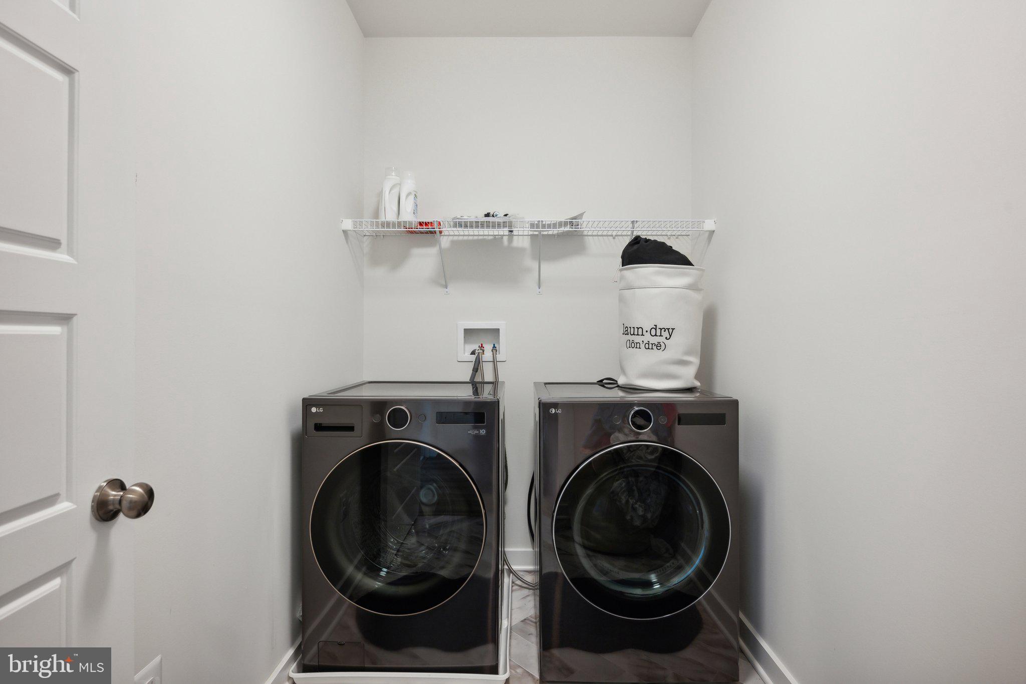 319 Summit Point Boulevard Bowie, MD 20716 - Photo 20 of 28 a utility room with dryer and washer