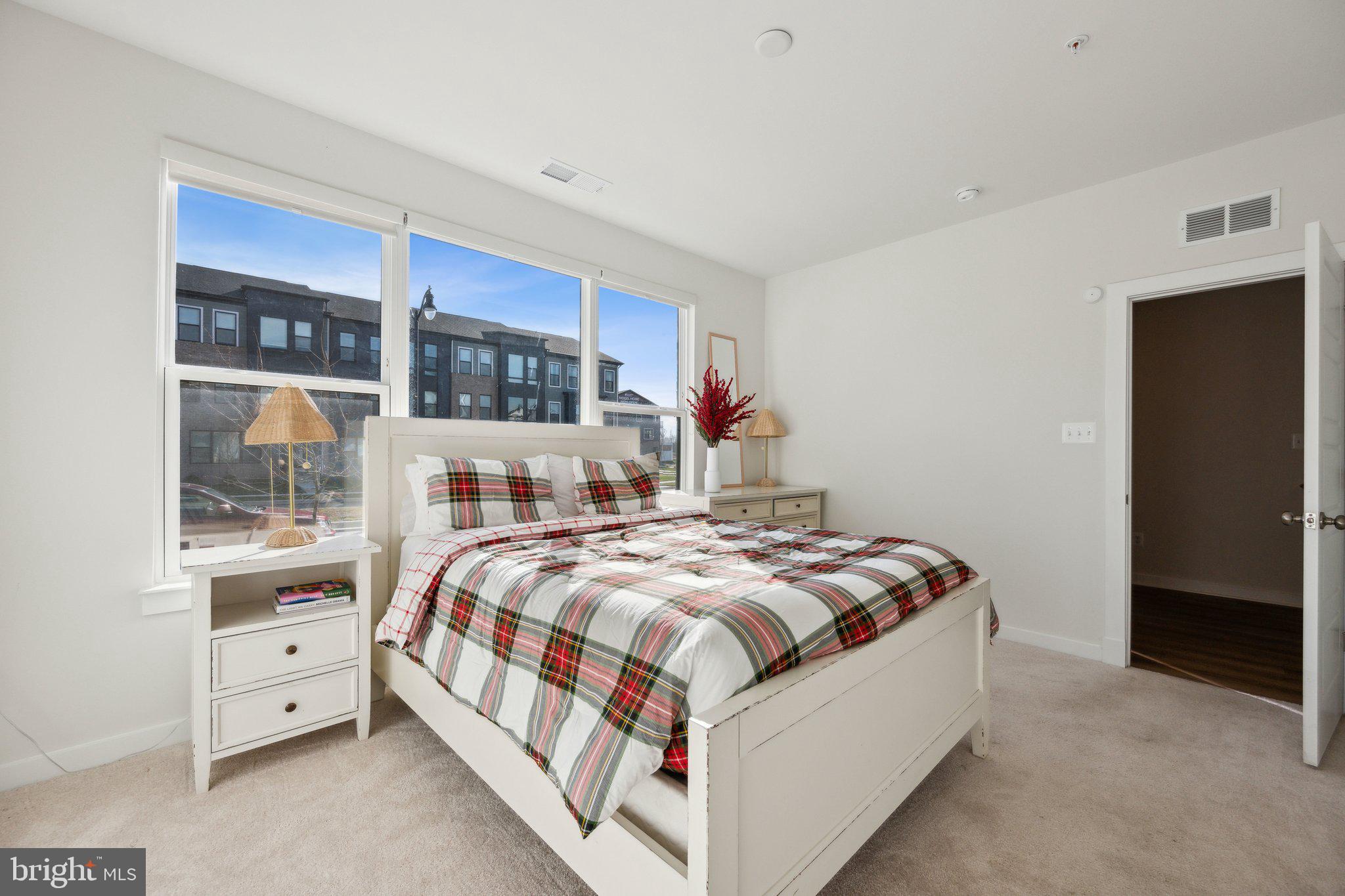 319 Summit Point Boulevard Bowie, MD 20716 - Photo 22 of 28 a bedroom with a bed and a window