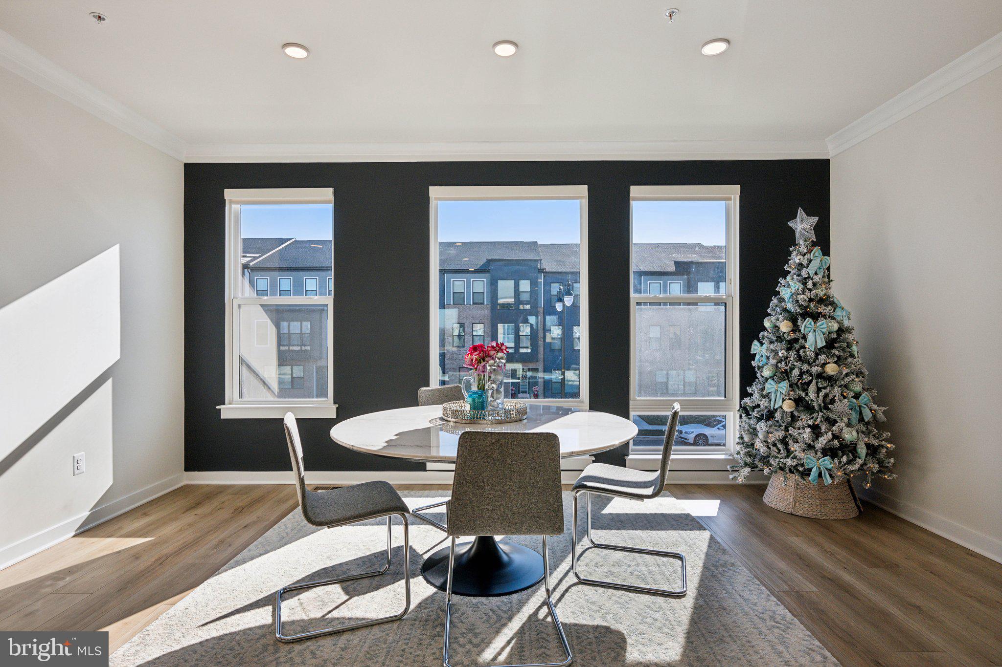 319 Summit Point Boulevard Bowie, MD 20716 - Photo 3 of 28 a living room with furniture and a large window