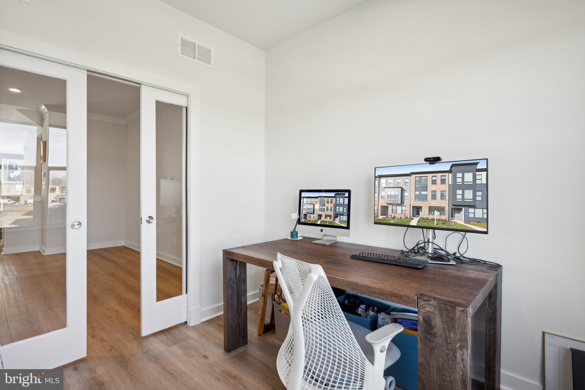319 Summit Point Boulevard Bowie, MD 20716 - Photo 7 of 28 a view of a dining room with furniture
