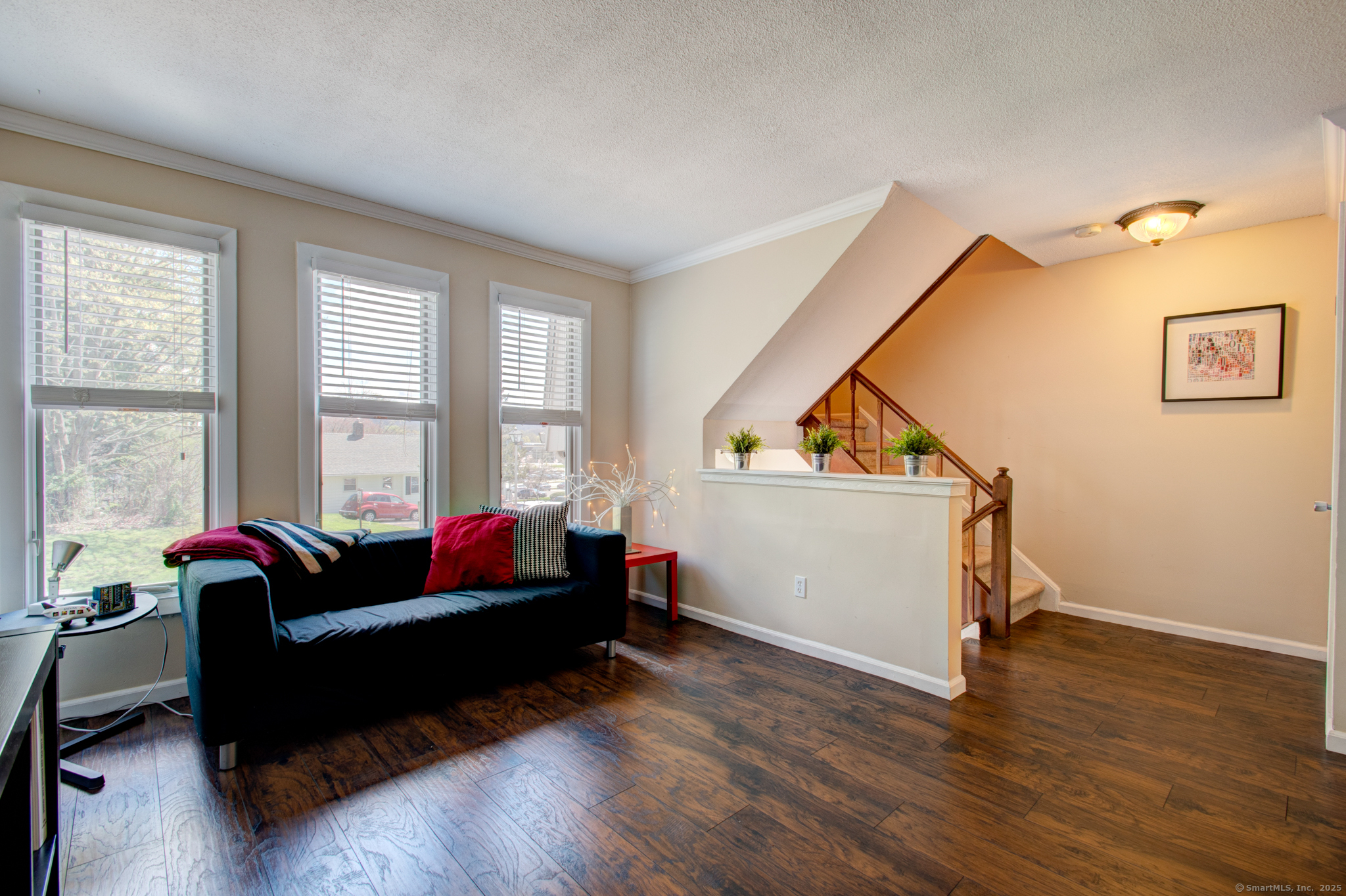 184 Gravel Street, Unit 26 Meriden, CT 06450 - Photo 11 of 27 a living room with furniture and a wooden floor
