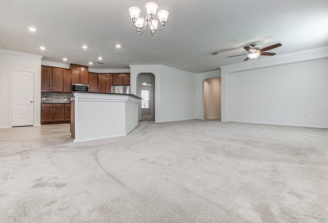 1237 Volente Lane Leander, TX 78641 - Photo 22 of 22 An open floorplan seamlessly connects the well-appointed kitchen with the spacious living area, ideal for entertaining.