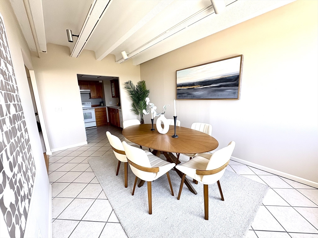 1731 Beacon Street, Unit 1502 Brookline, MA 02445 - Photo 11 of 27 a view of a dining room with furniture