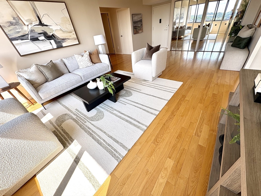 1731 Beacon Street, Unit 1502 Brookline, MA 02445 - Photo 7 of 27 a living room with furniture and a table