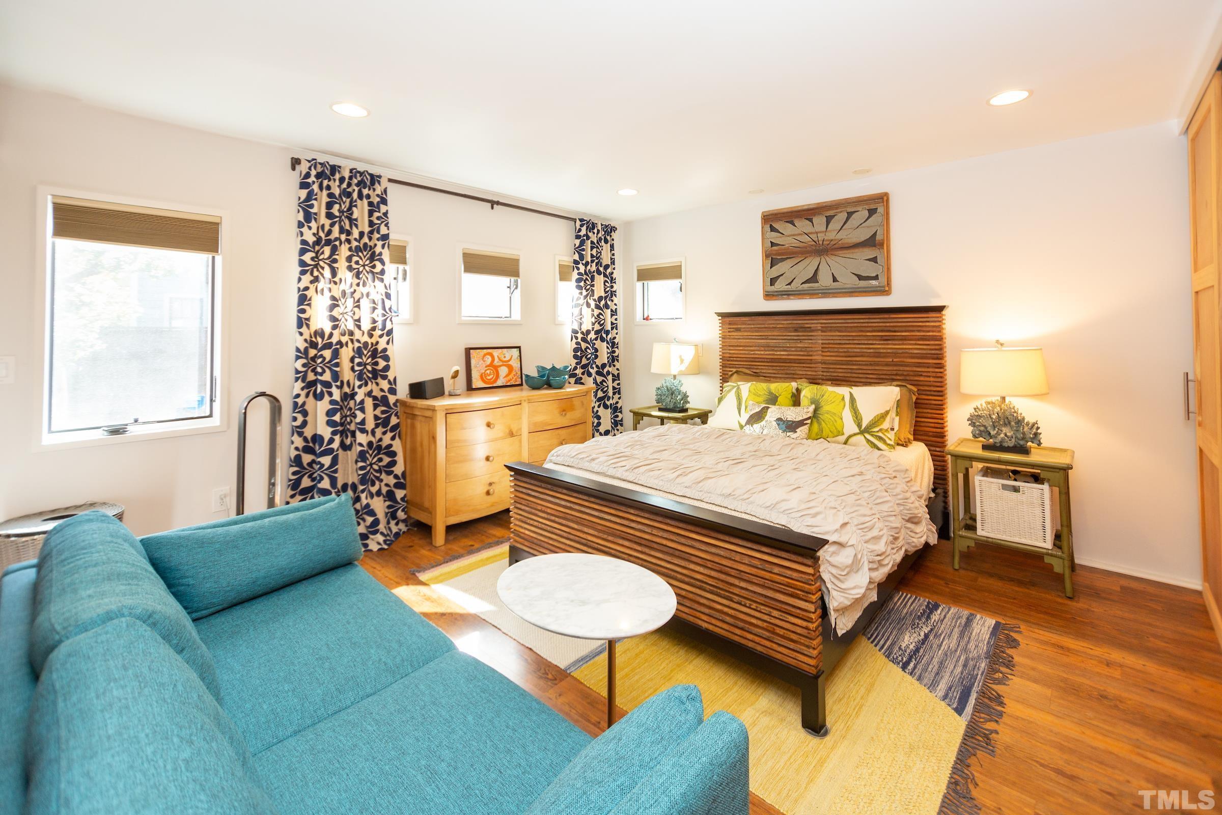 116 Solterra Way Durham, NC 27705 - Photo 13 of 30 a bedroom with a bed and wooden floor