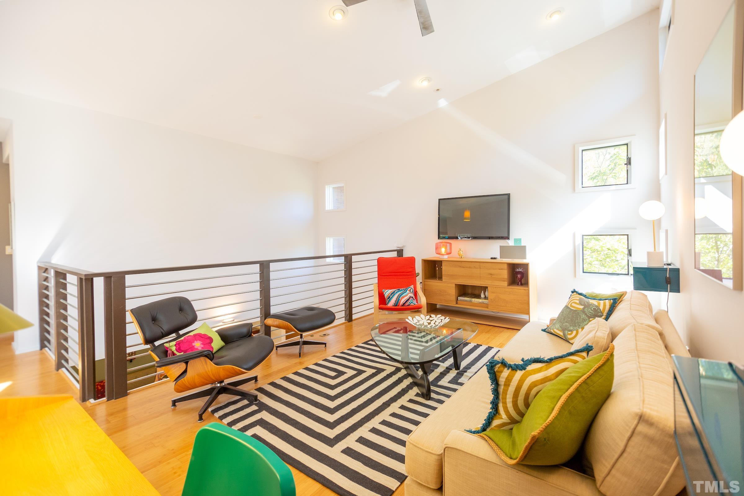 116 Solterra Way Durham, NC 27705 - Photo 20 of 30 a living room with furniture and a flat screen tv