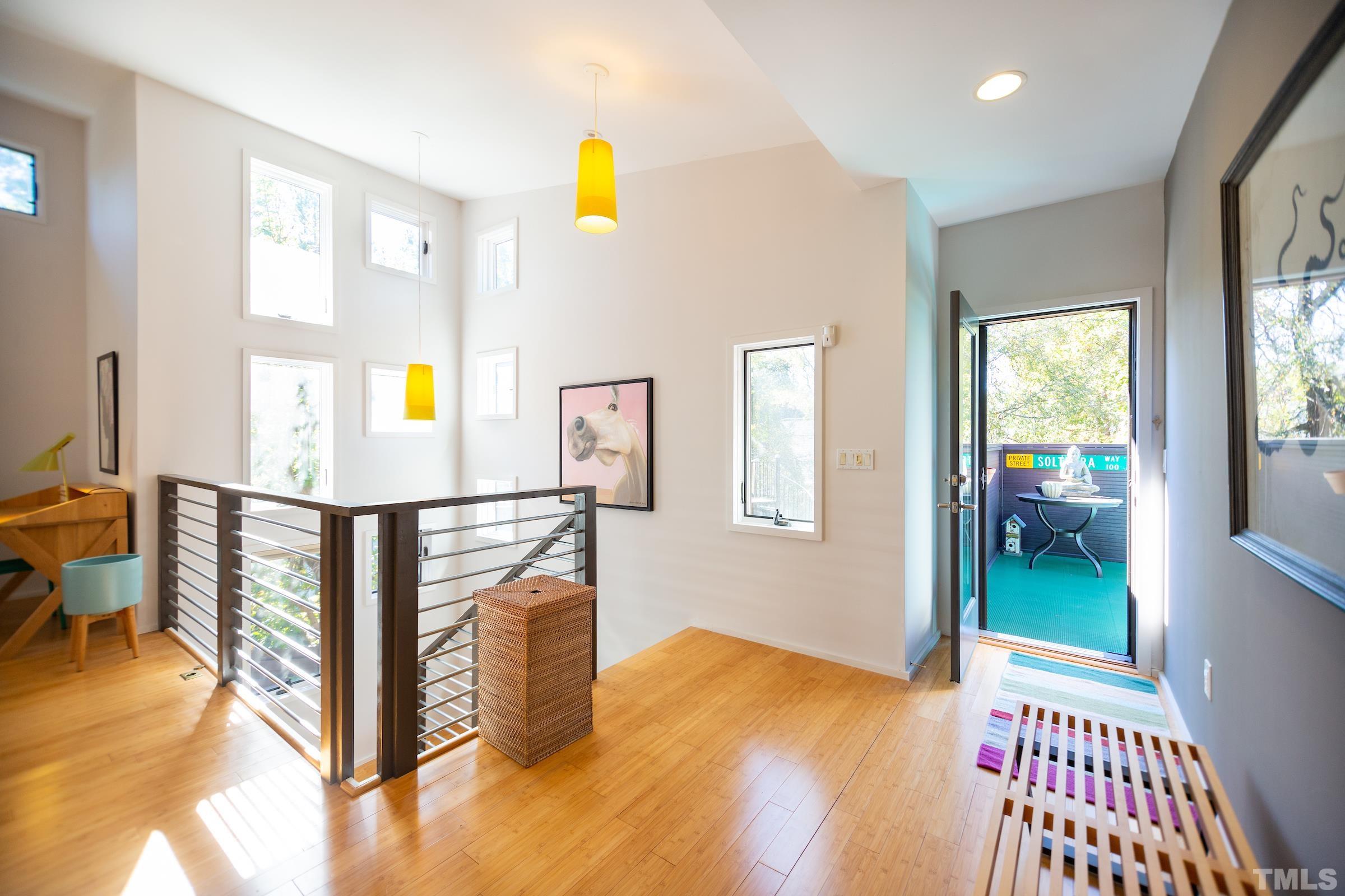116 Solterra Way Durham, NC 27705 - Photo 22 of 30 a view of a kitchen with furniture wooden floor and windows