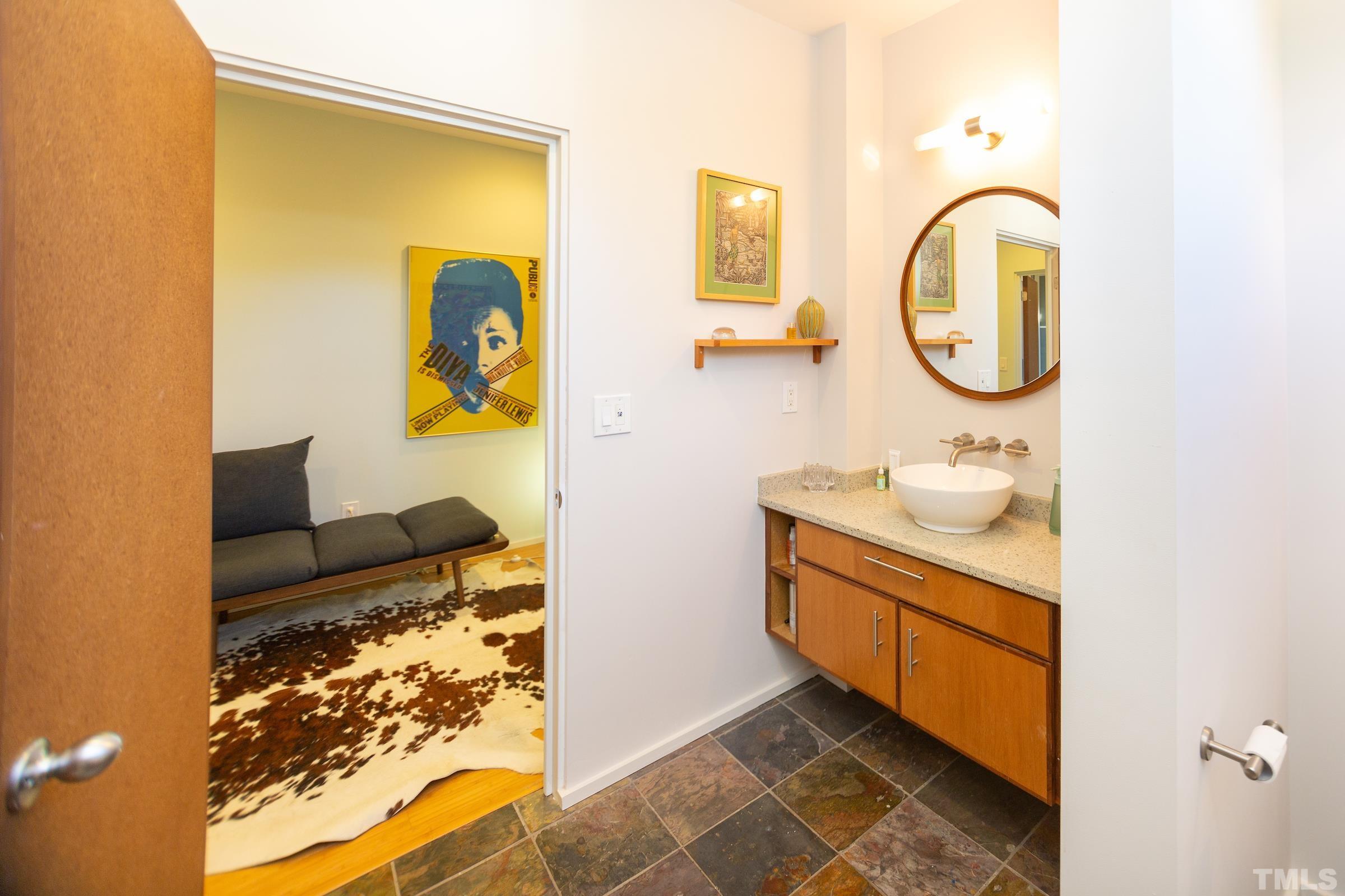 116 Solterra Way Durham, NC 27705 - Photo 26 of 30 a bathroom with a sink and a mirror