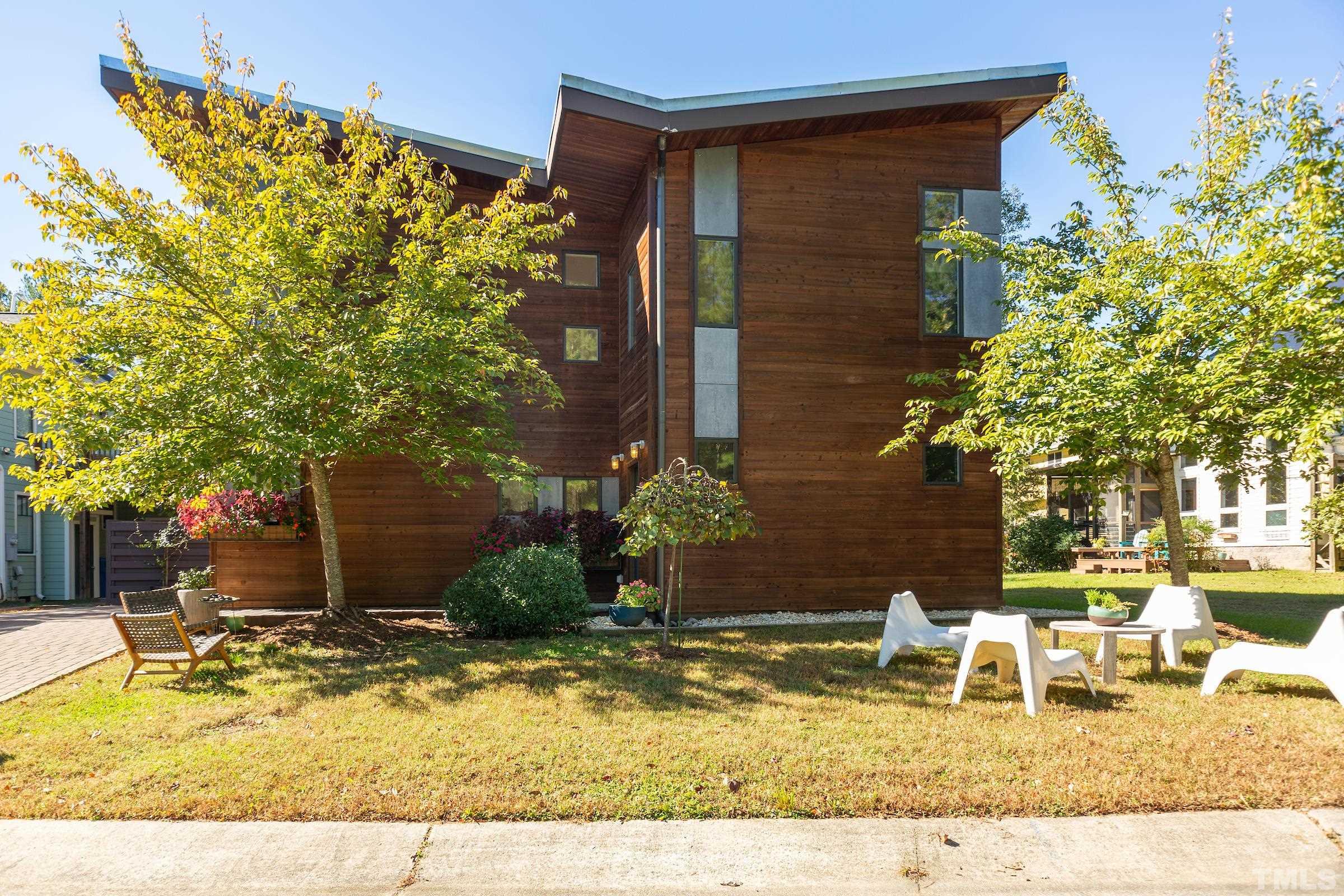 116 Solterra Way Durham, NC 27705 - Photo 28 of 30 a backyard of a house with yard and outdoor seating