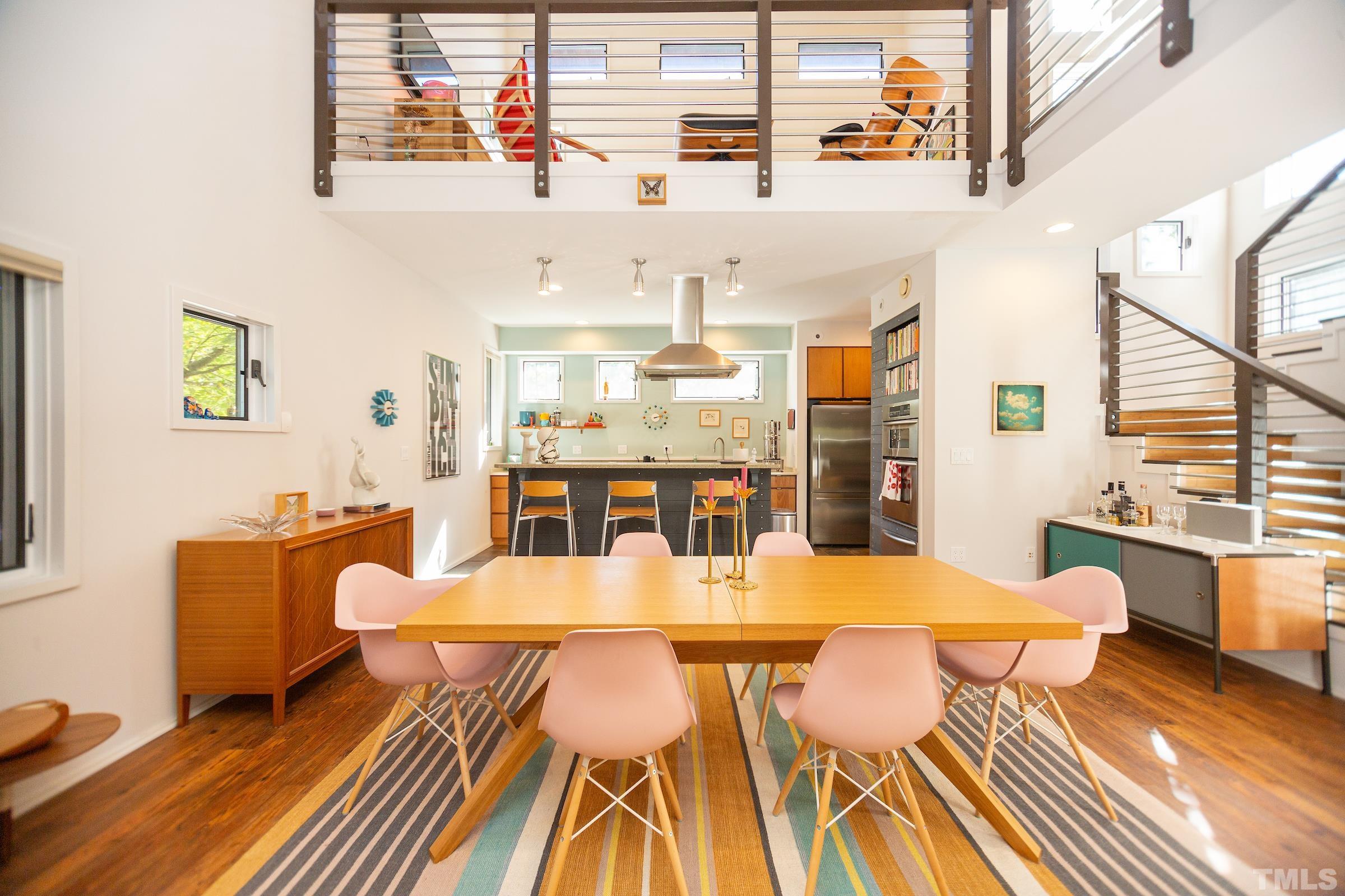 116 Solterra Way Durham, NC 27705 - Photo 7 of 30 a view of a dining room with furniture a chandelier and wooden floor