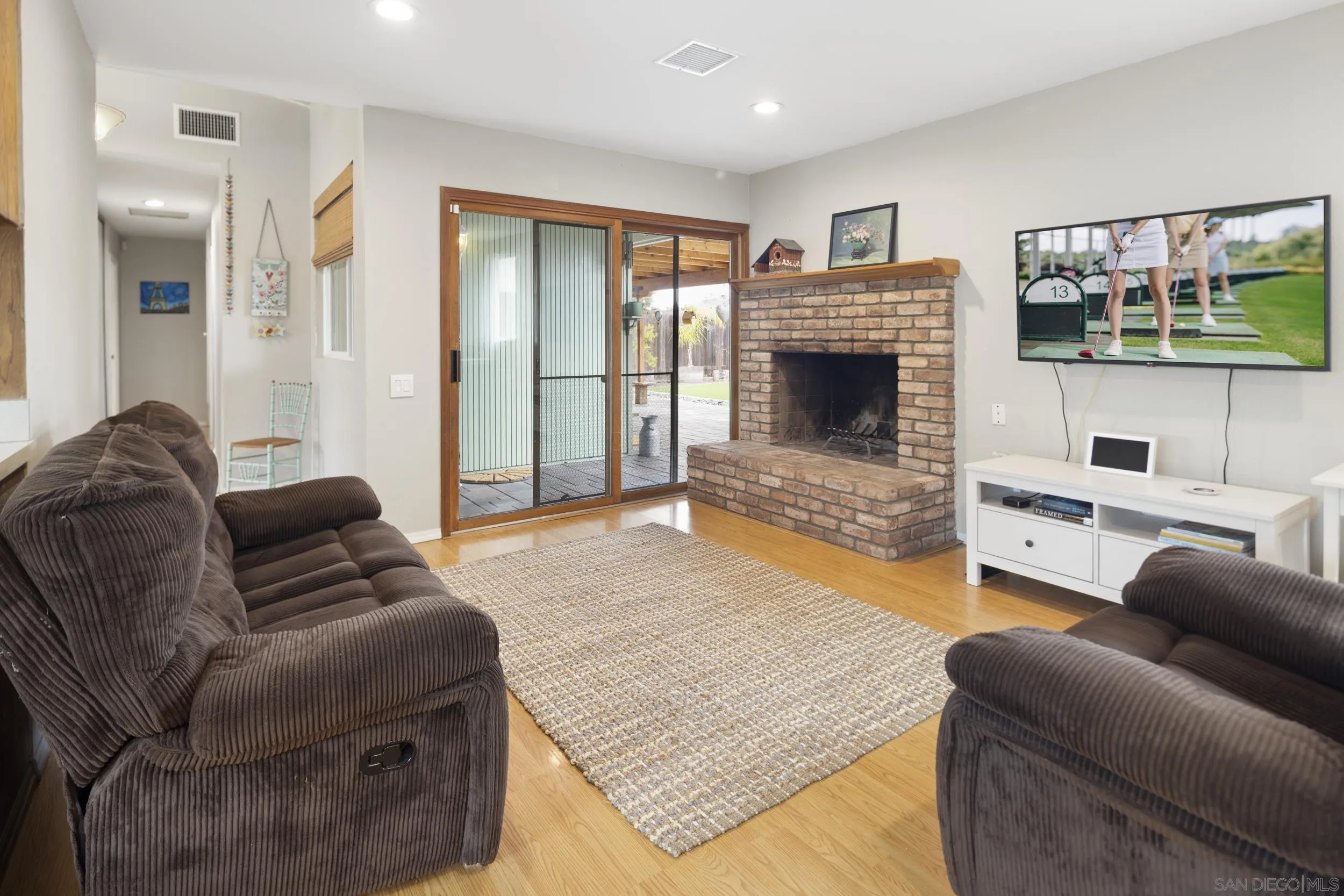 622 Ellen Lane El Cajon, CA 92019 - Photo 11 of 17 a living room with furniture and a fireplace