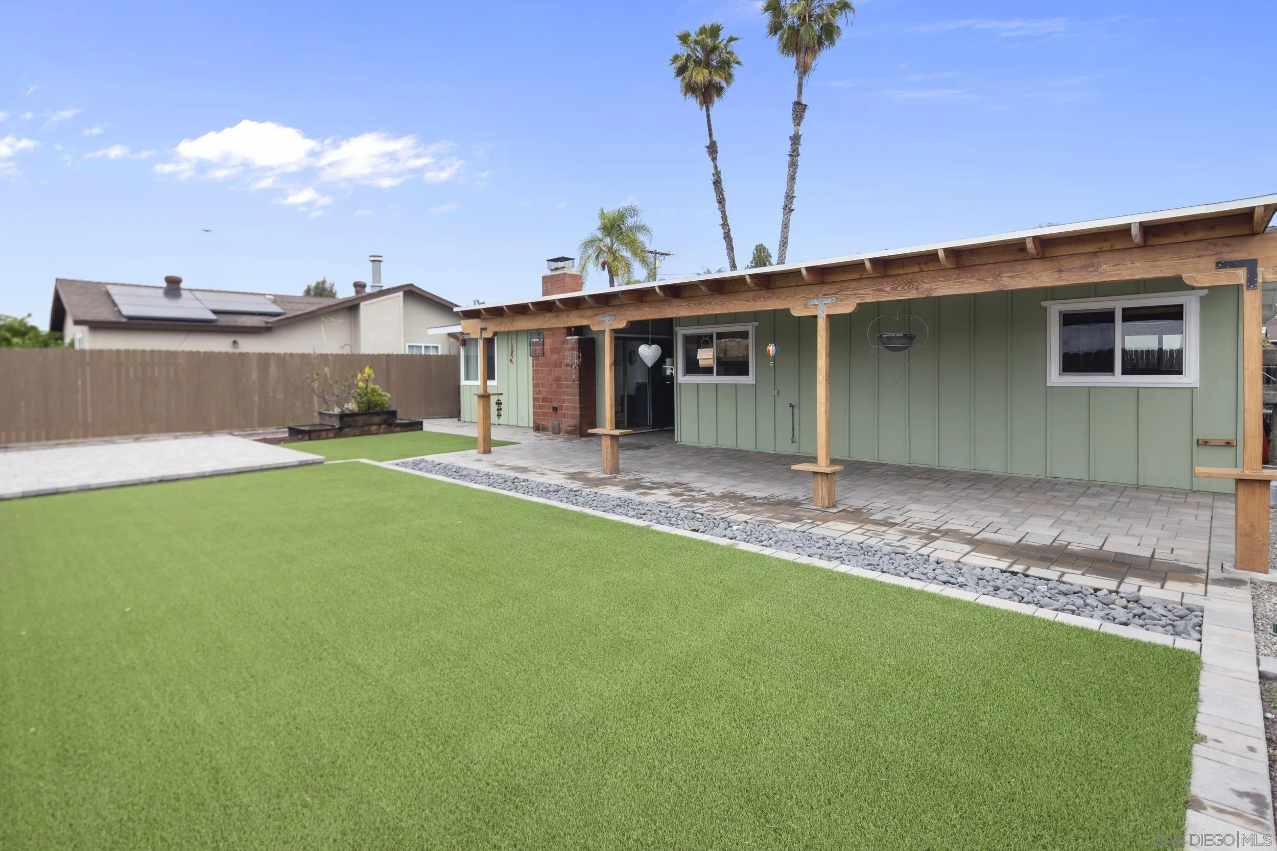 622 Ellen Lane El Cajon, CA 92019 - Photo 2 of 17 a backyard of a house with yard and outdoor seating