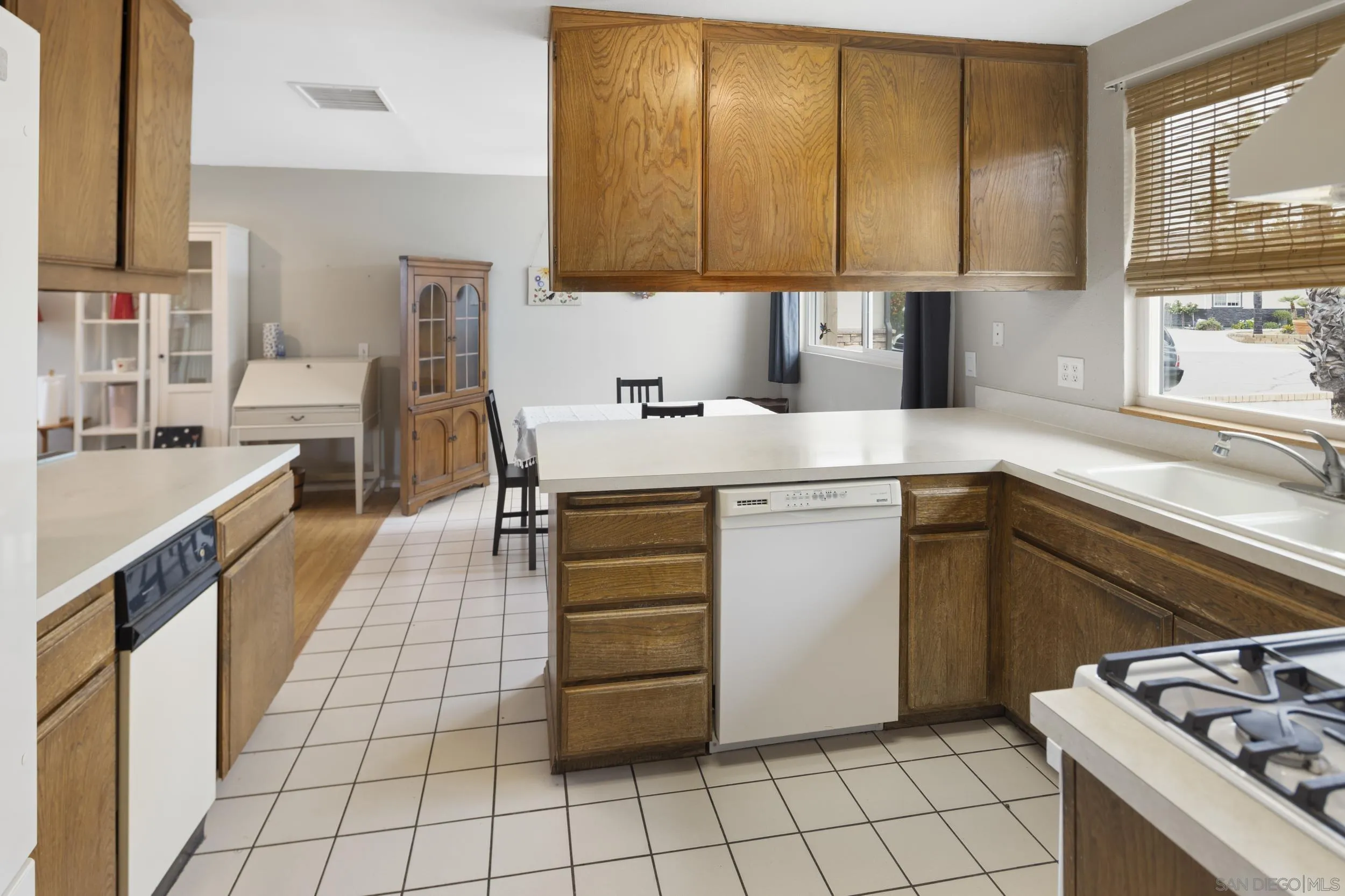 622 Ellen Lane El Cajon, CA 92019 - Photo 7 of 17 a kitchen with a sink cabinets and window