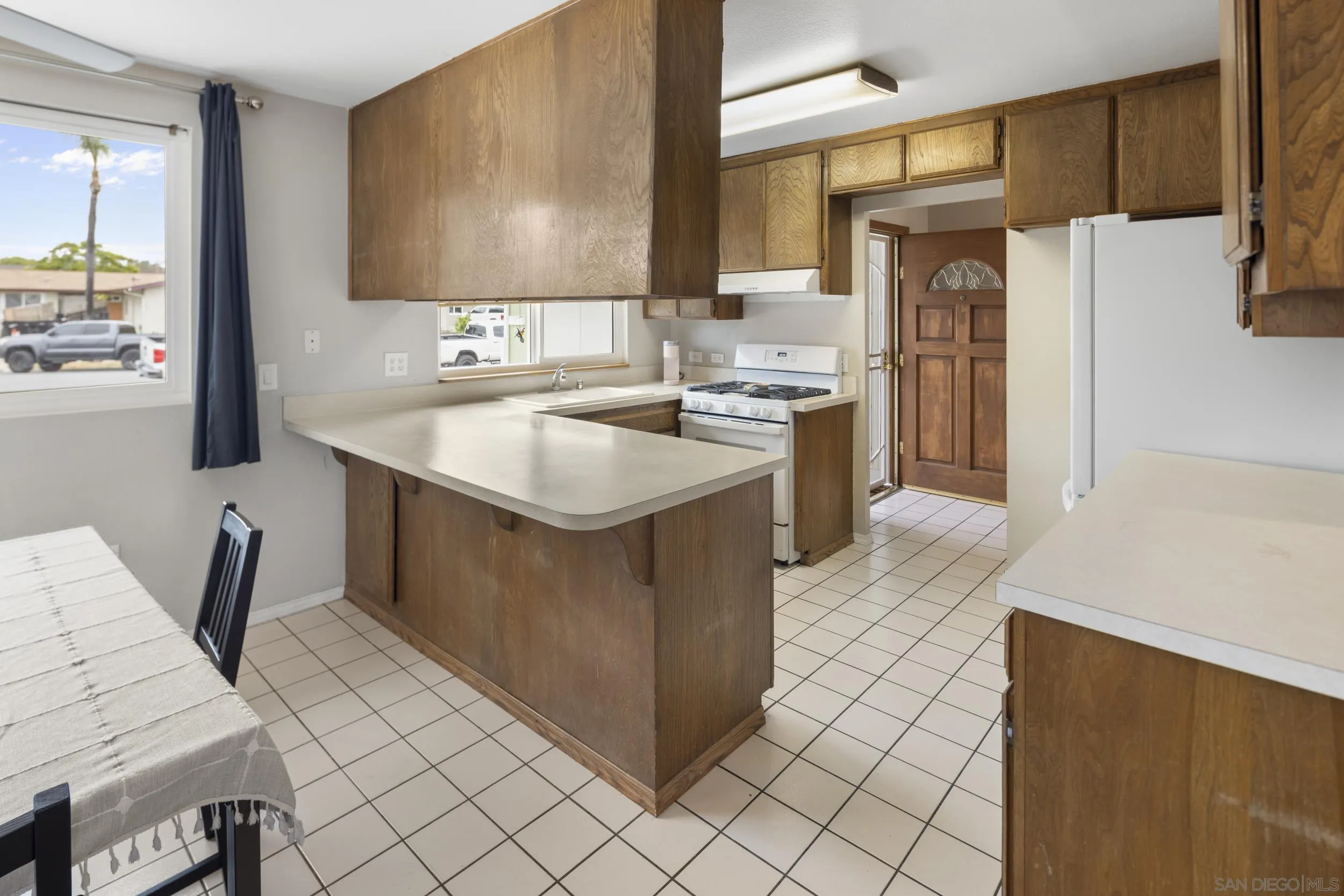 622 Ellen Lane El Cajon, CA 92019 - Photo 8 of 17 a kitchen with stainless steel appliances granite countertop a sink stove and refrigerator