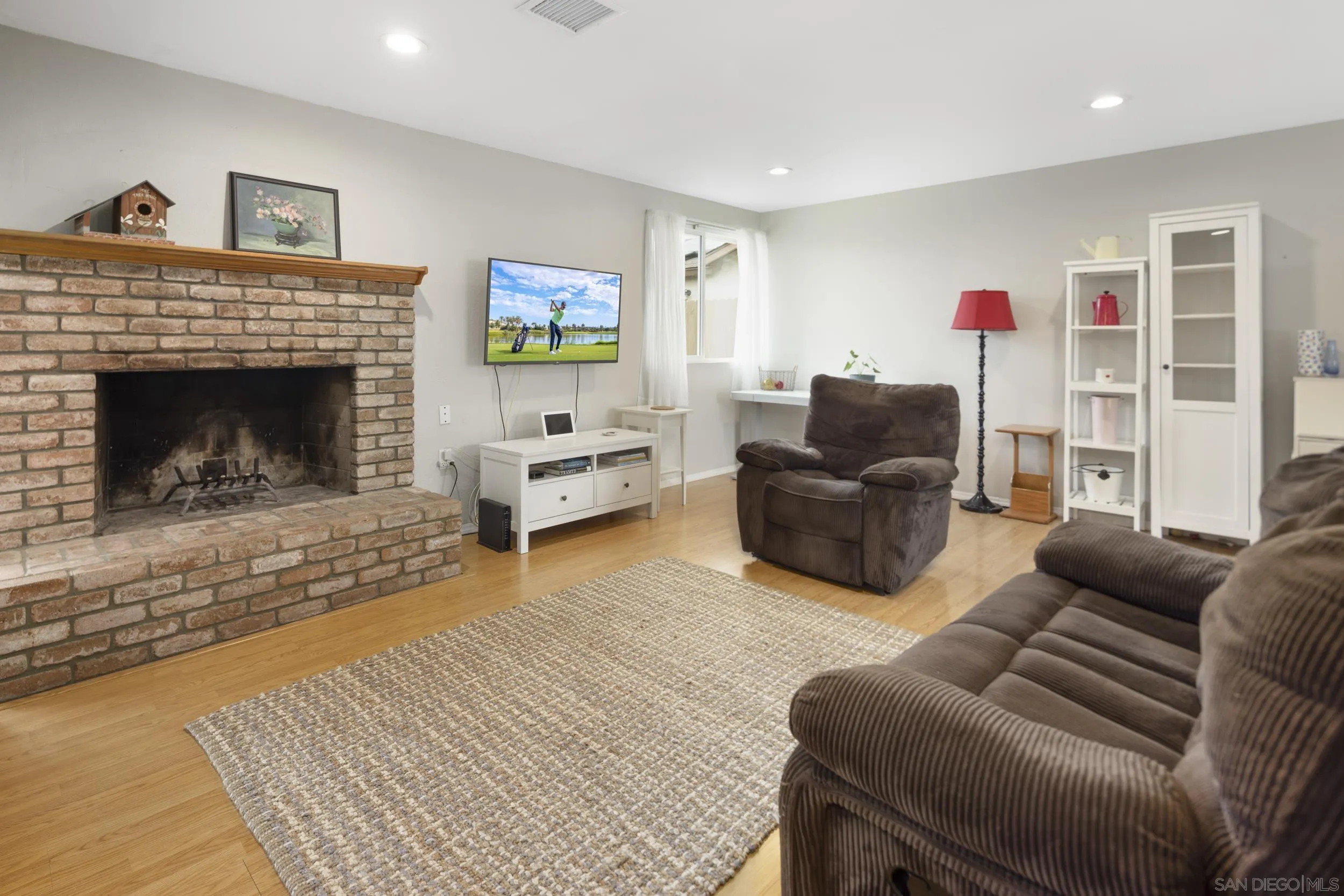 622 Ellen Lane El Cajon, CA 92019 - Photo 10 of 17 a living room with furniture and a fireplace