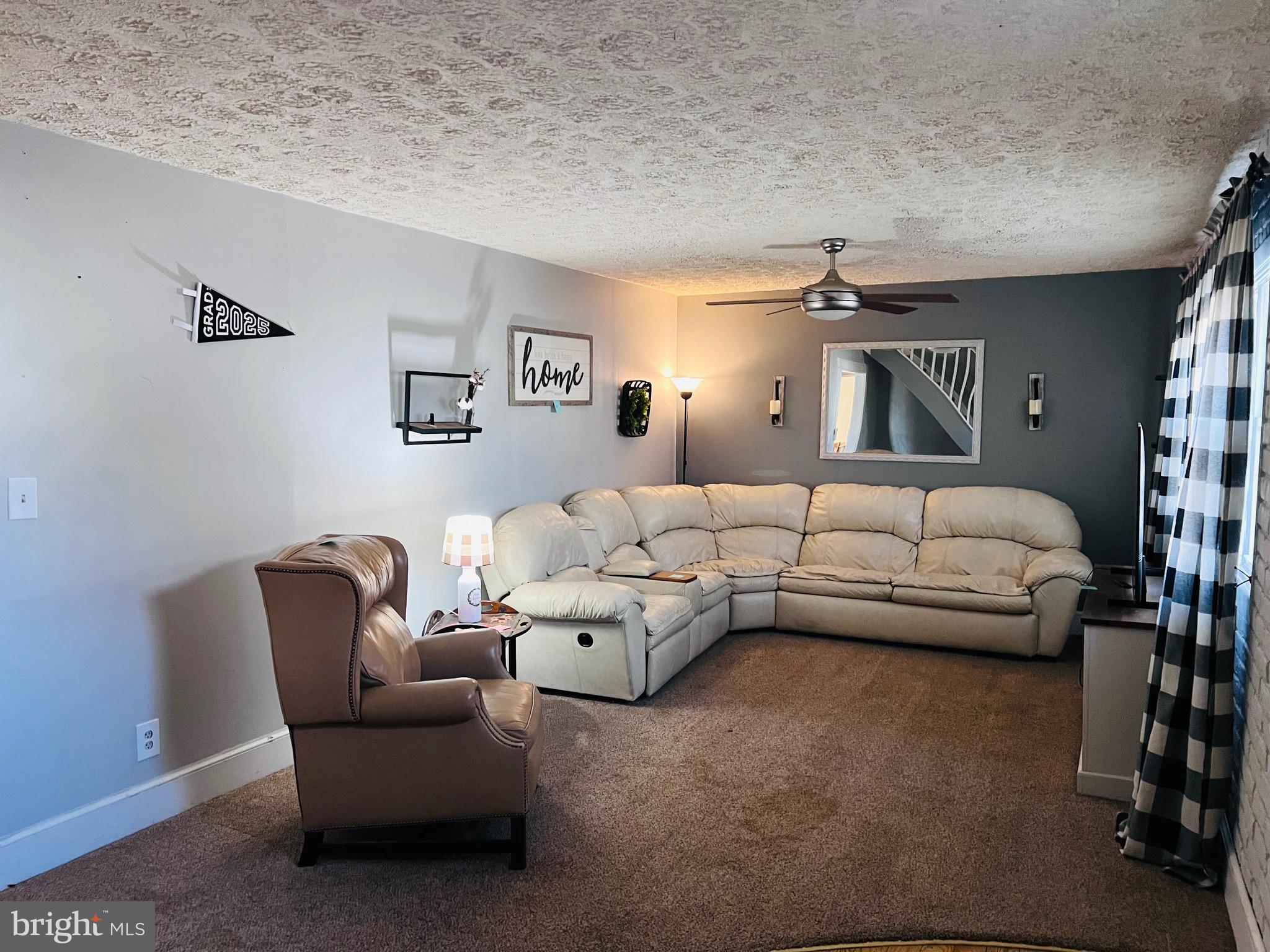320 Cedar Avenue Colonial Beach, VA 22443 - Photo 12 of 47 a living room with furniture and a couch