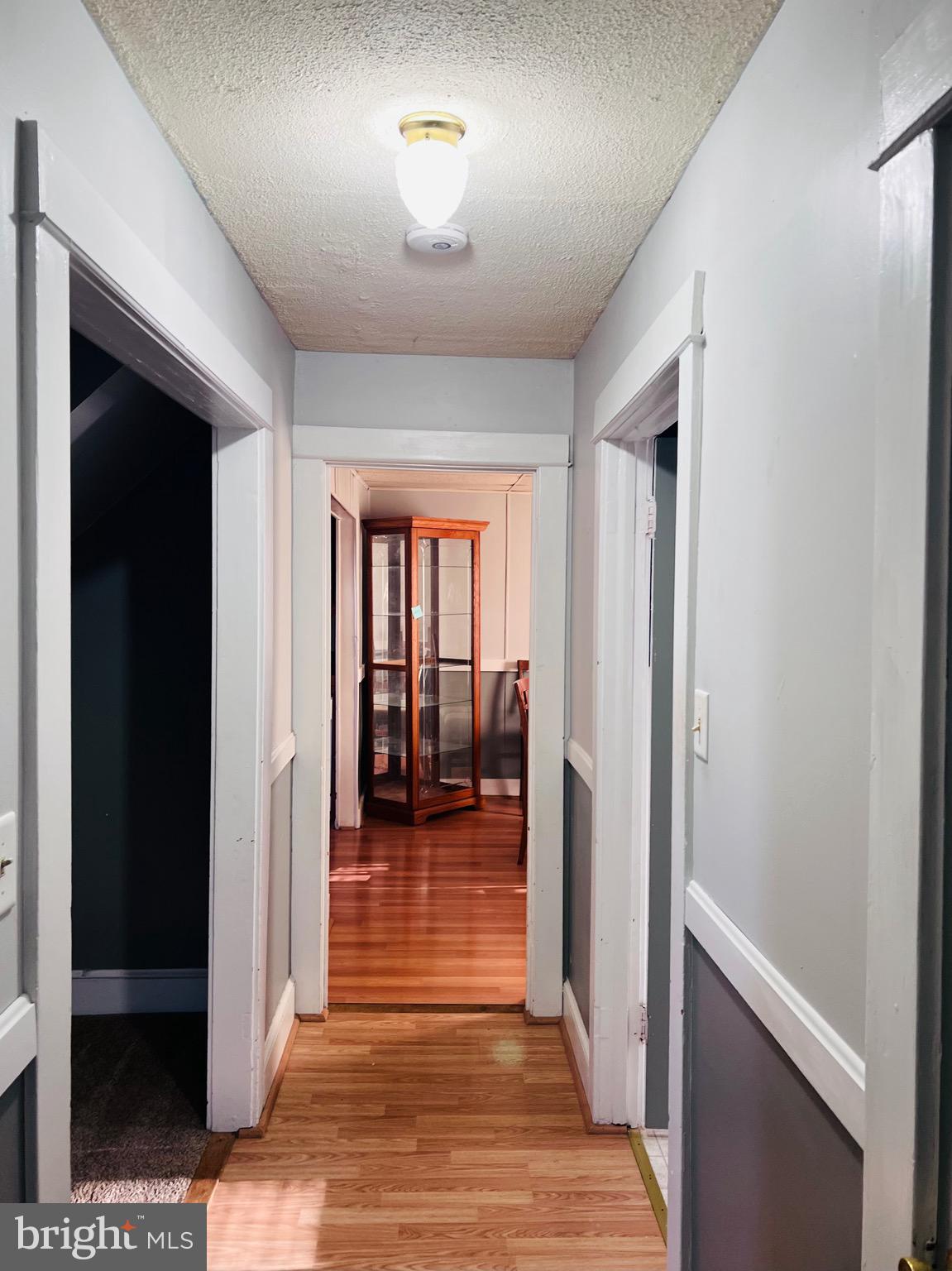 320 Cedar Avenue Colonial Beach, VA 22443 - Photo 15 of 47 a view of a hallway view with wooden floor and staircase