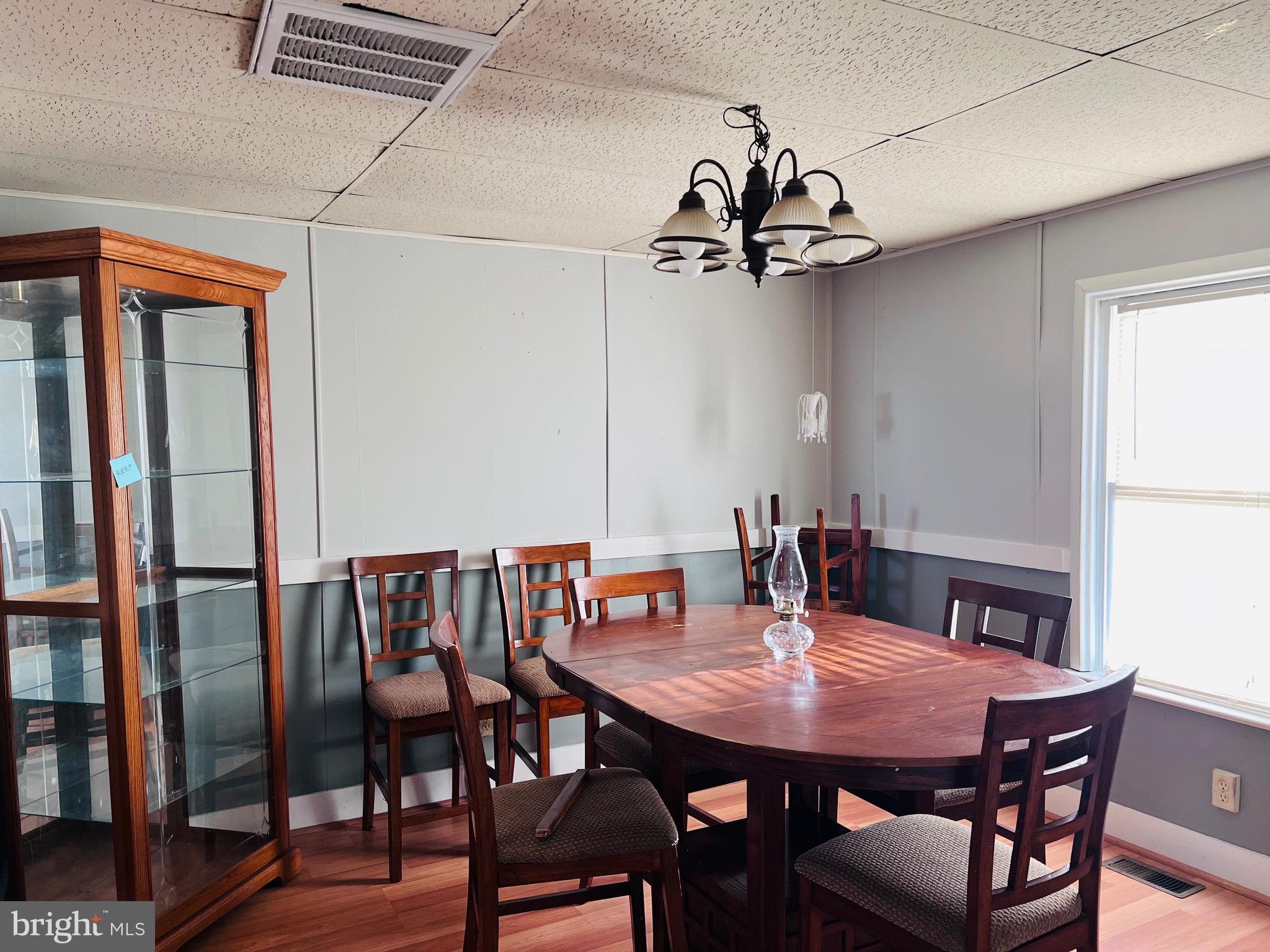 320 Cedar Avenue Colonial Beach, VA 22443 - Photo 19 of 47 a view of a dining room with furniture window and wooden floor