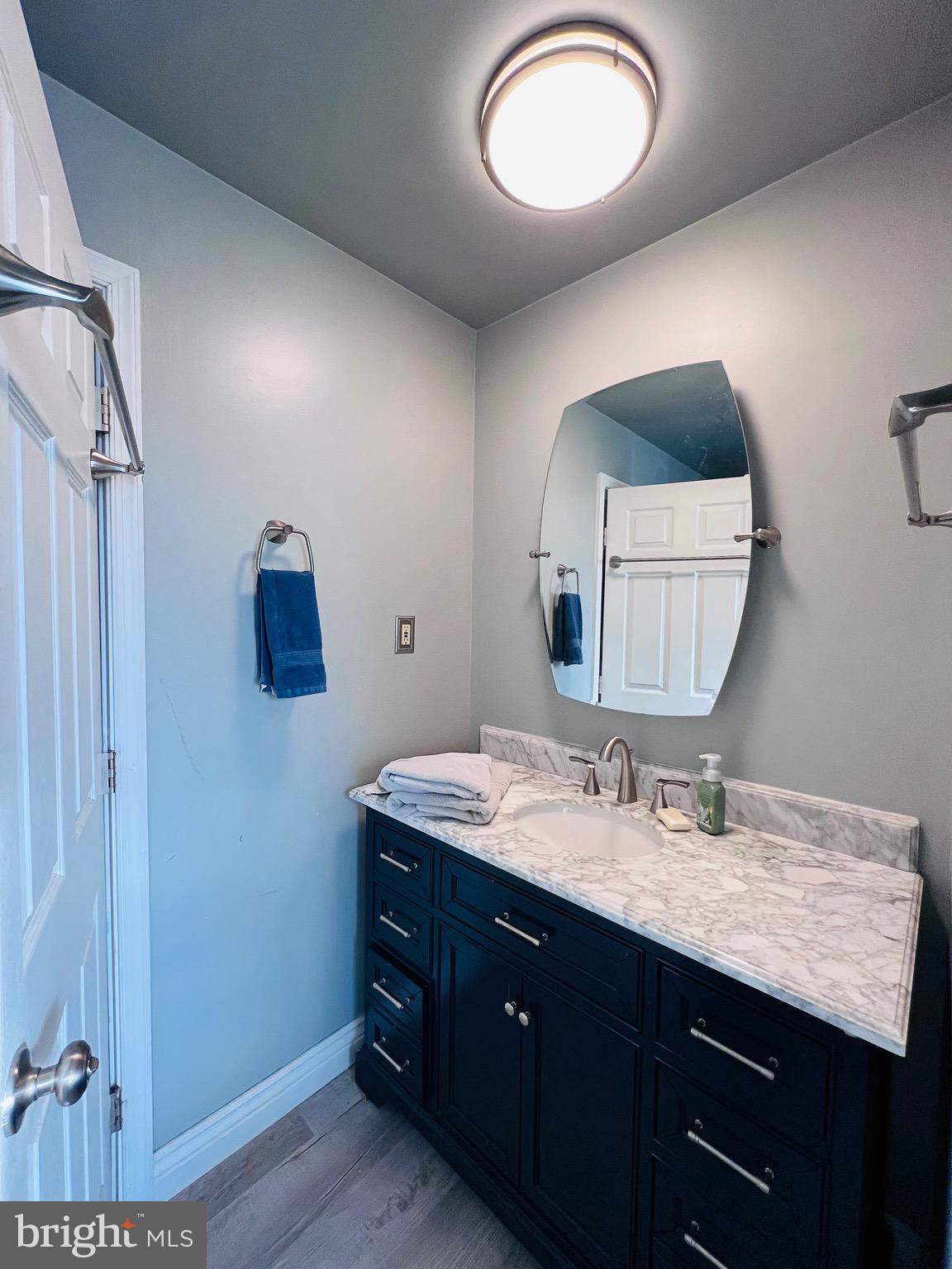 320 Cedar Avenue Colonial Beach, VA 22443 - Photo 27 of 47 a bathroom with a sink and a mirror
