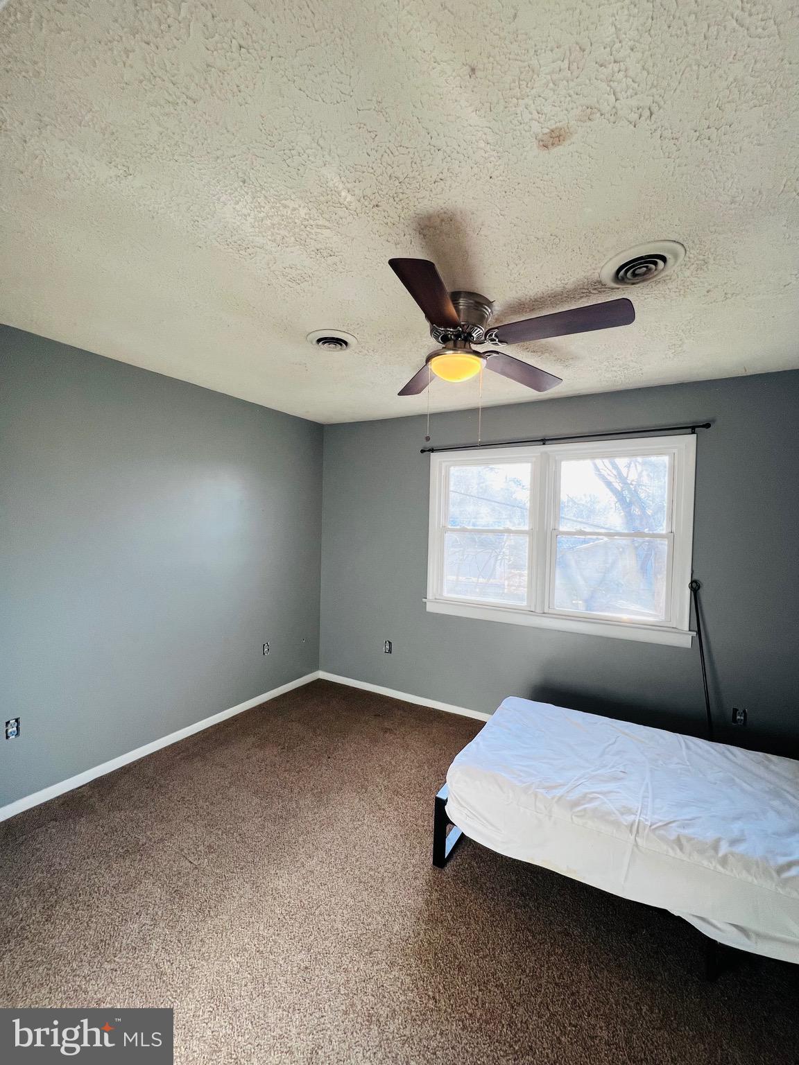 320 Cedar Avenue Colonial Beach, VA 22443 - Photo 34 of 47 a bedroom with a bed and window