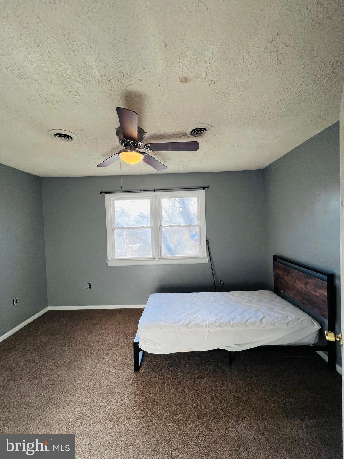 320 Cedar Avenue Colonial Beach, VA 22443 - Photo 35 of 47 a bedroom with a bed and window