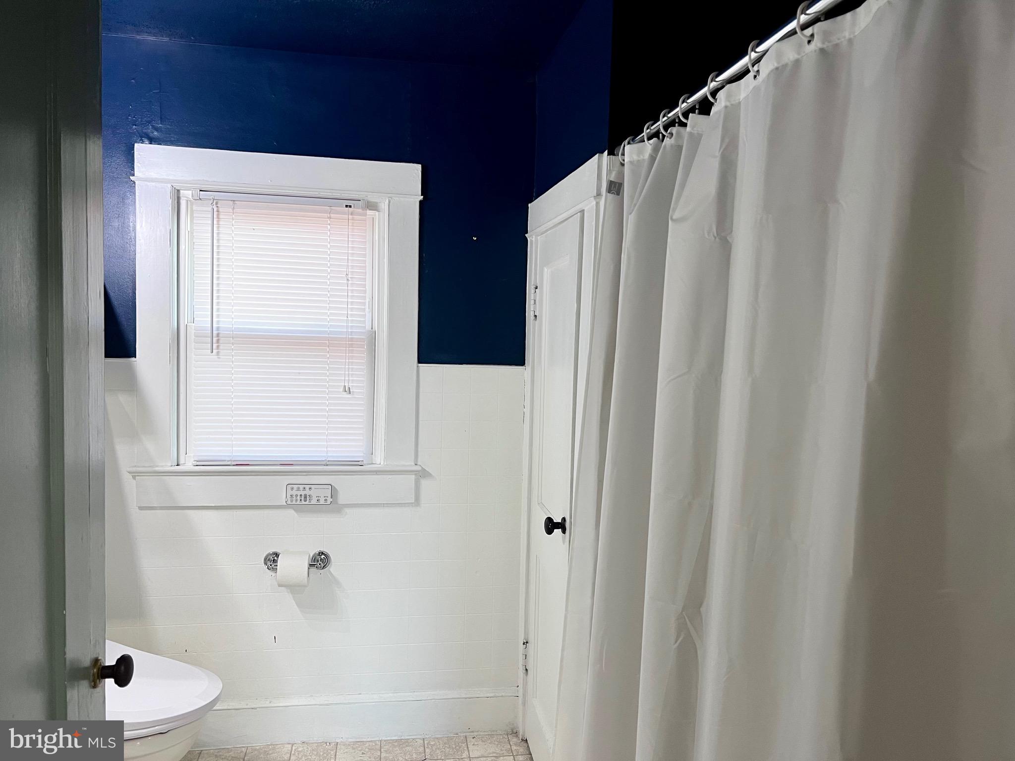 320 Cedar Avenue Colonial Beach, VA 22443 - Photo 37 of 47 a bathroom with double vanity and a shower curtain