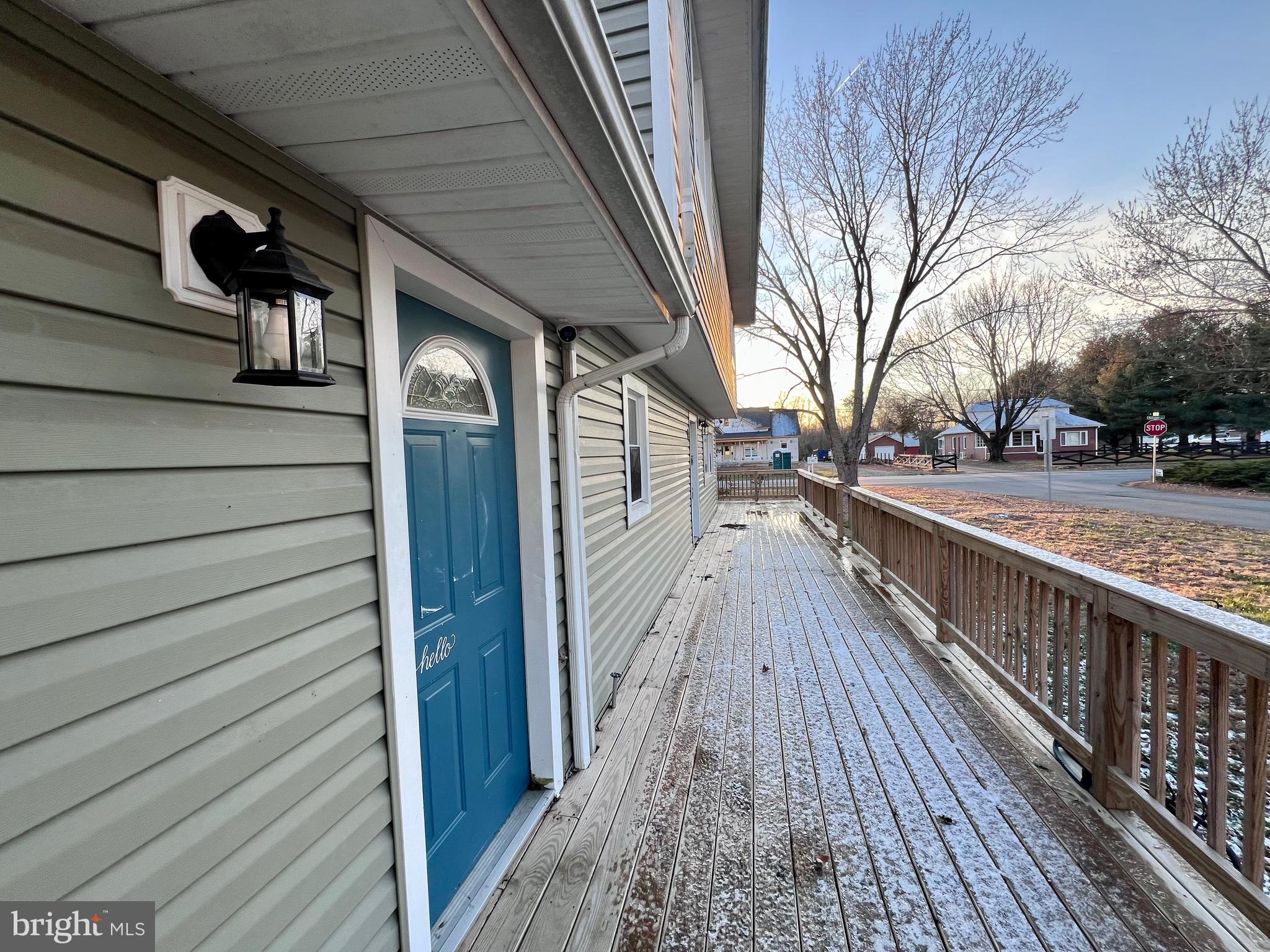 320 Cedar Avenue Colonial Beach, VA 22443 - Photo 46 of 47 a view of a balcony with wooden floor and floor to ceiling window