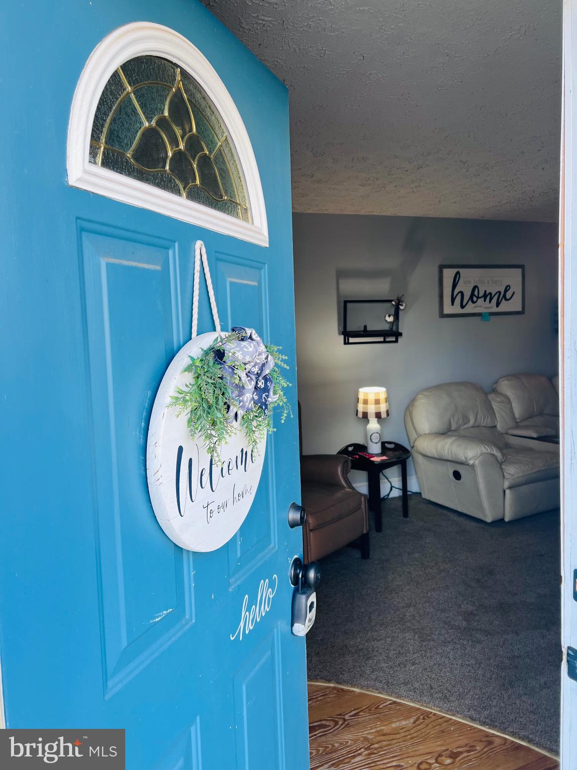 320 Cedar Avenue Colonial Beach, VA 22443 - Photo 9 of 47 a living room with a couch and a table