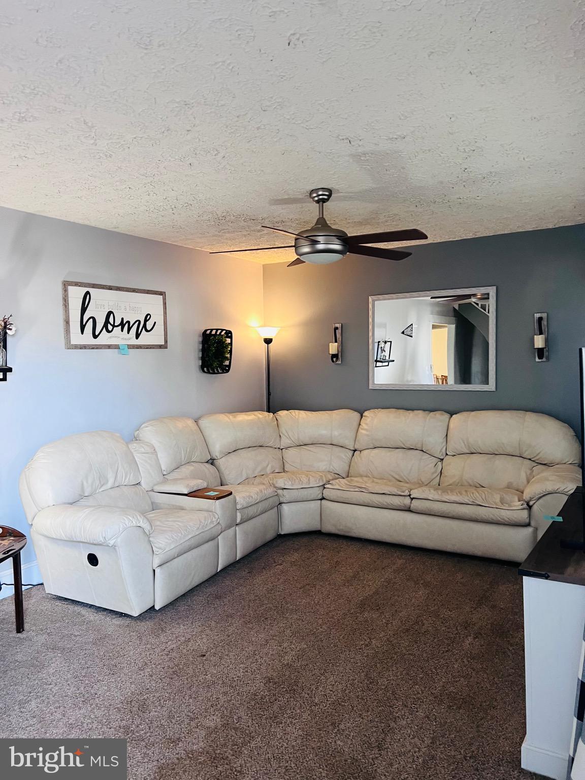 320 Cedar Avenue Colonial Beach, VA 22443 - Photo 10 of 47 a living room with furniture and a night stand