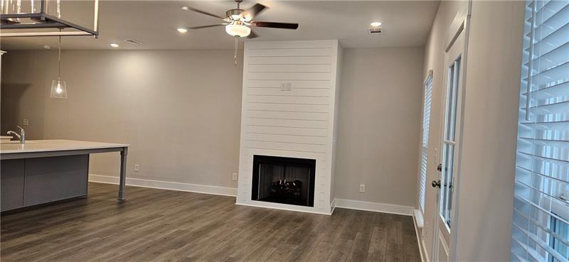 1727 Prospect Way Conyers, GA 30094 - Photo 15 of 38 a view of an empty room with wooden floor and a window