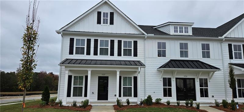 1727 Prospect Way Conyers, GA 30094 - Photo 2 of 38 a front view of a residential apartment building with a yard
