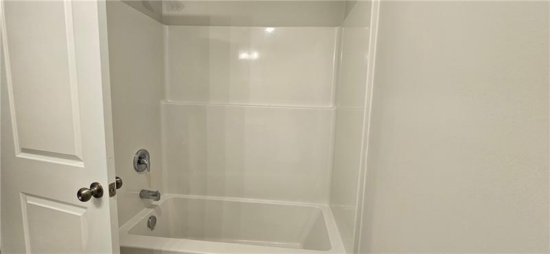 1727 Prospect Way Conyers, GA 30094 - Photo 25 of 38 a bathroom with a bathtub