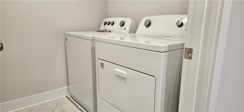 1727 Prospect Way Conyers, GA 30094 - Photo 29 of 38 a utility room with dryer and washer