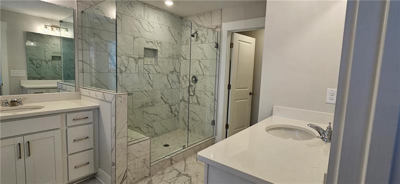 1727 Prospect Way Conyers, GA 30094 - Photo 37 of 38 a bathroom with a sink a toilet and shower