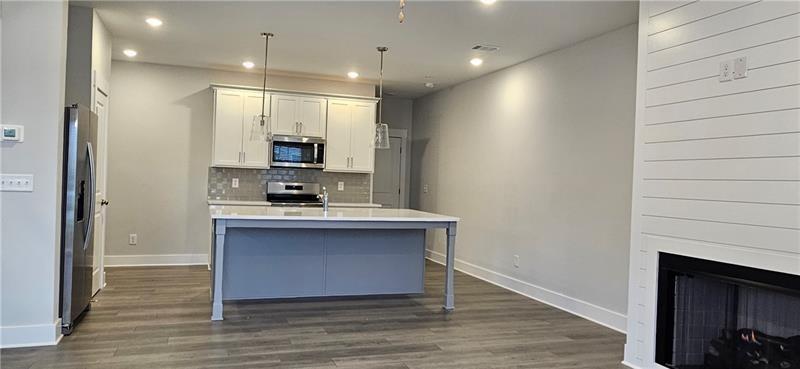 1727 Prospect Way Conyers, GA 30094 - Photo 7 of 38 a view of kitchen with sink and wooden floor