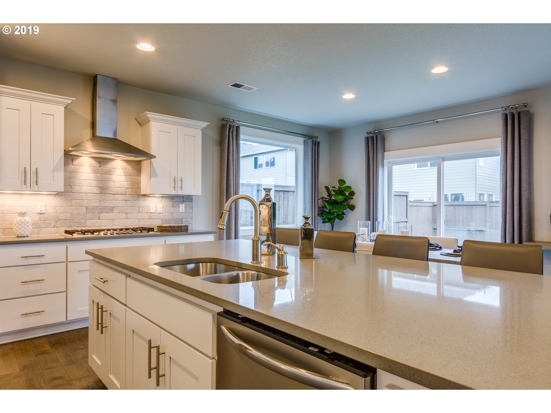15975 Southwest Wren Lane Beaverton, OR 97007 - Photo 12 of 23 a kitchen with counter space a sink and cabinets