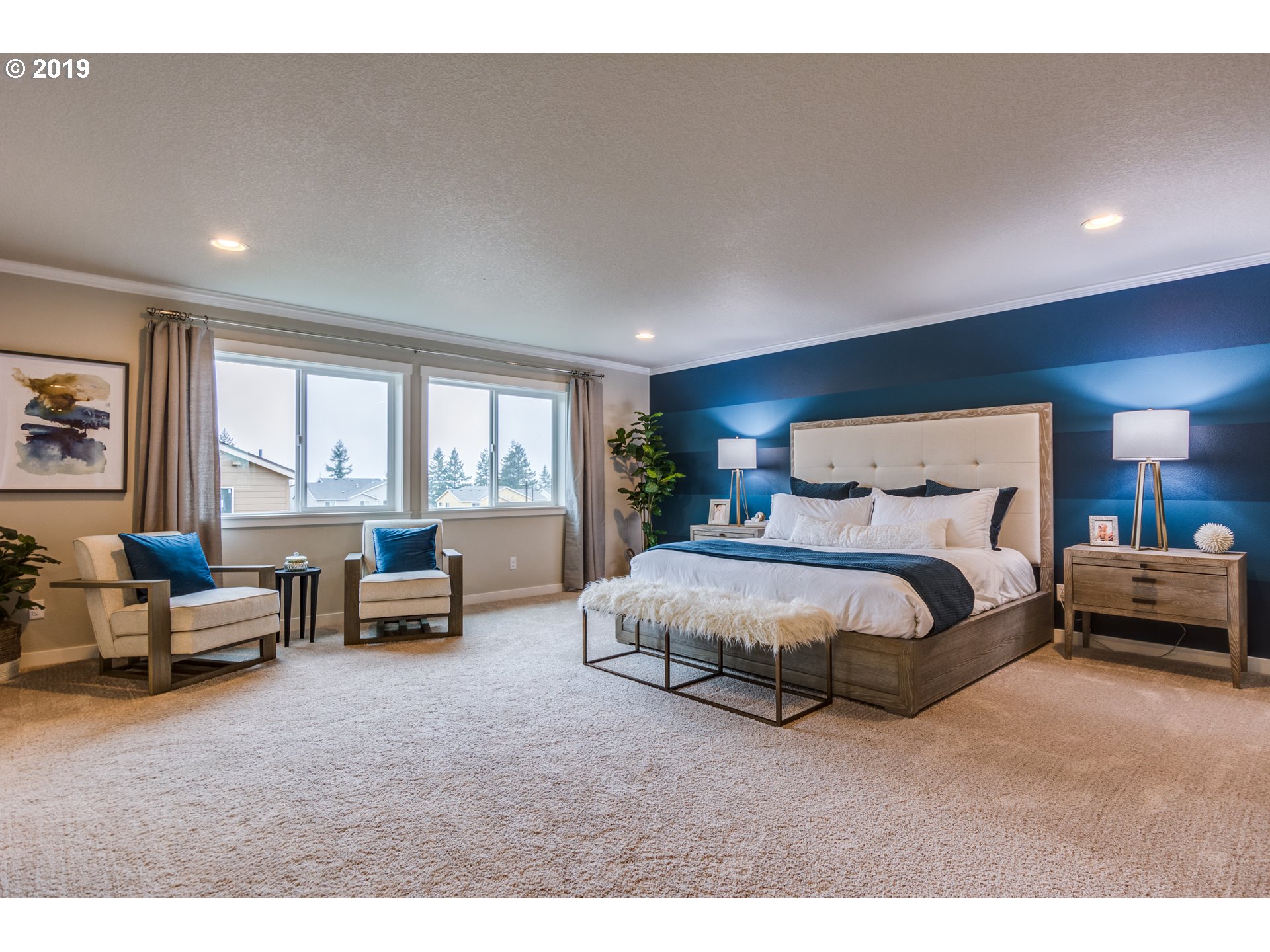 15975 Southwest Wren Lane Beaverton, OR 97007 - Photo 18 of 23 a spacious bedroom with a bed and large windows