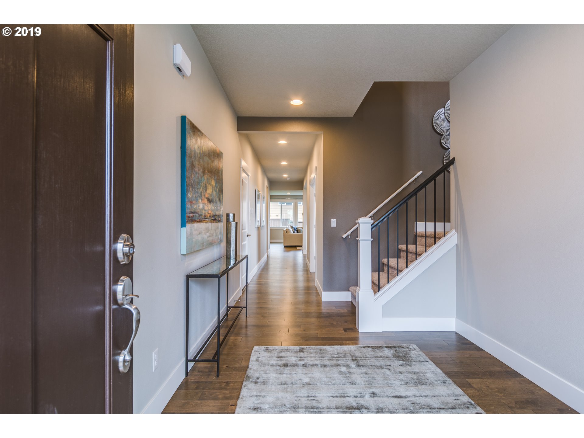 15975 Southwest Wren Lane Beaverton, OR 97007 - Photo 3 of 23 a view of entryway and hall with wooden floor