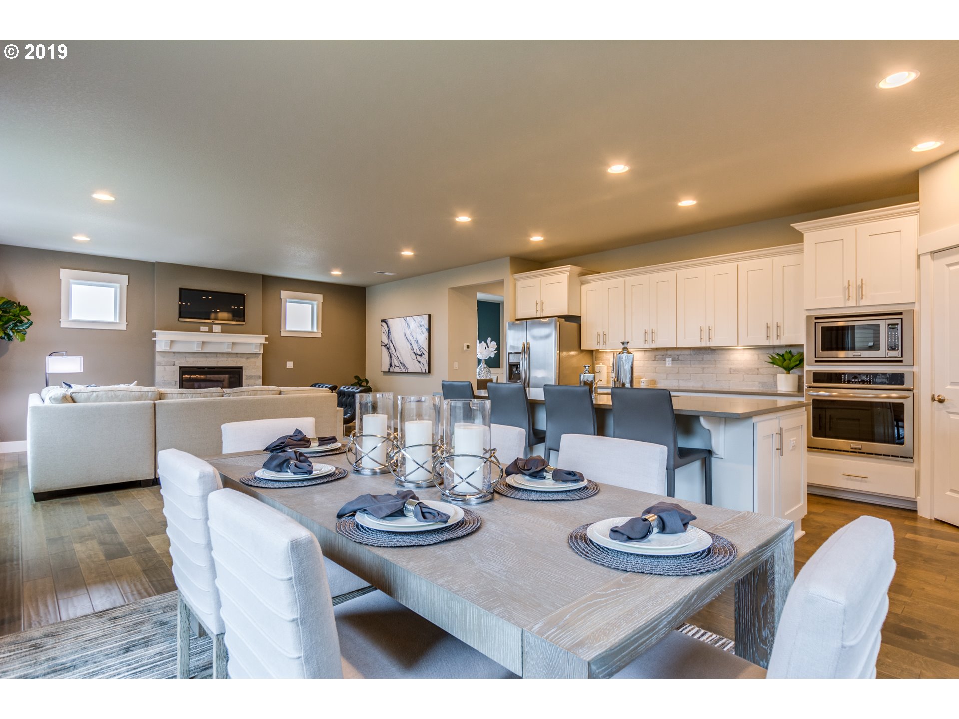 15975 Southwest Wren Lane Beaverton, OR 97007 - Photo 9 of 23 a kitchen with stainless steel appliances kitchen island granite countertop a sink and cabinets
