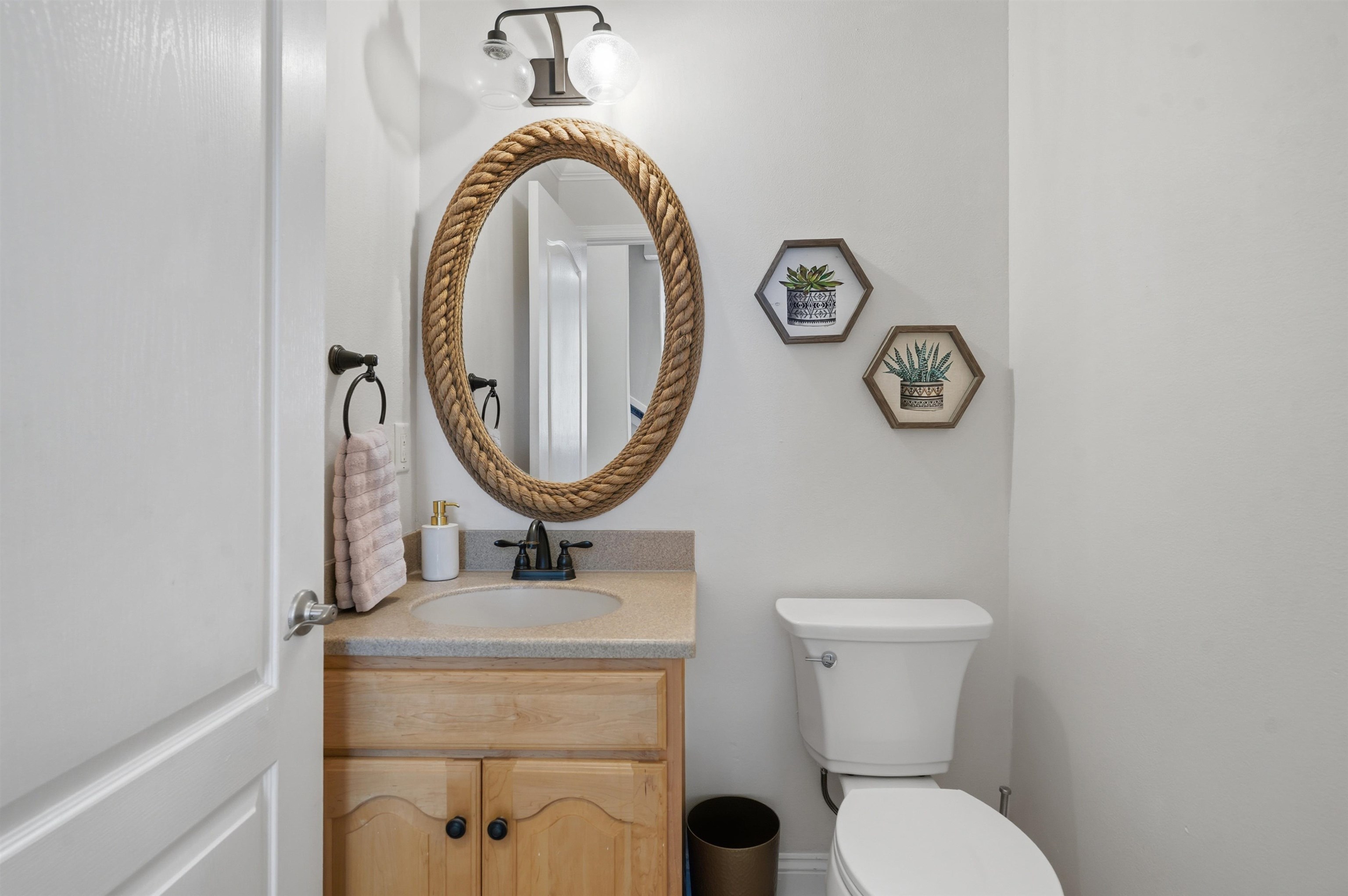 2 Lisbon Street St. Augustine, FL 32080 - Photo 11 of 39 a bathroom with a toilet mirror and vanity