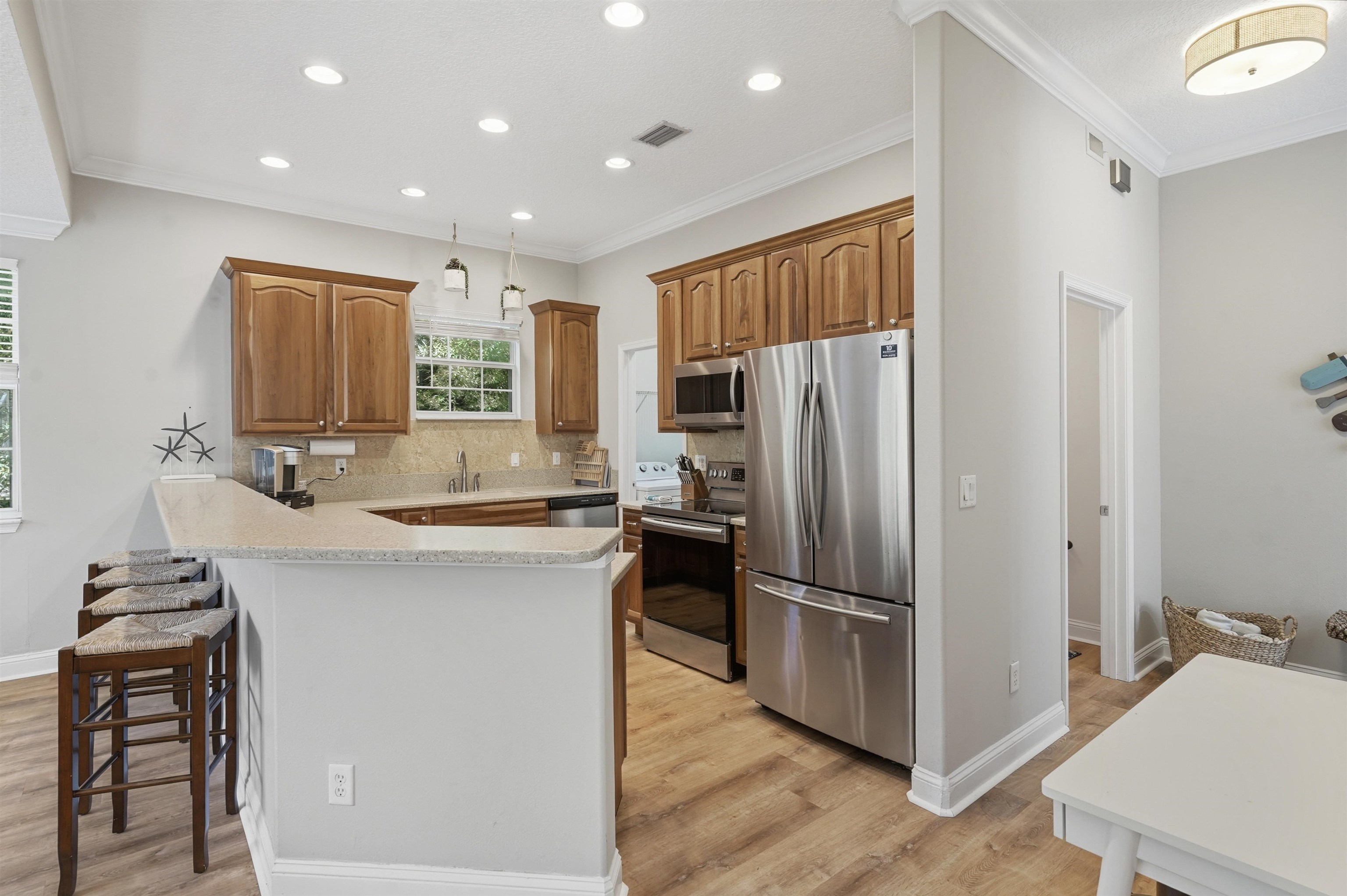 2 Lisbon Street St. Augustine, FL 32080 - Photo 12 of 39 a kitchen with kitchen island a counter top space stainless steel appliances and cabinets