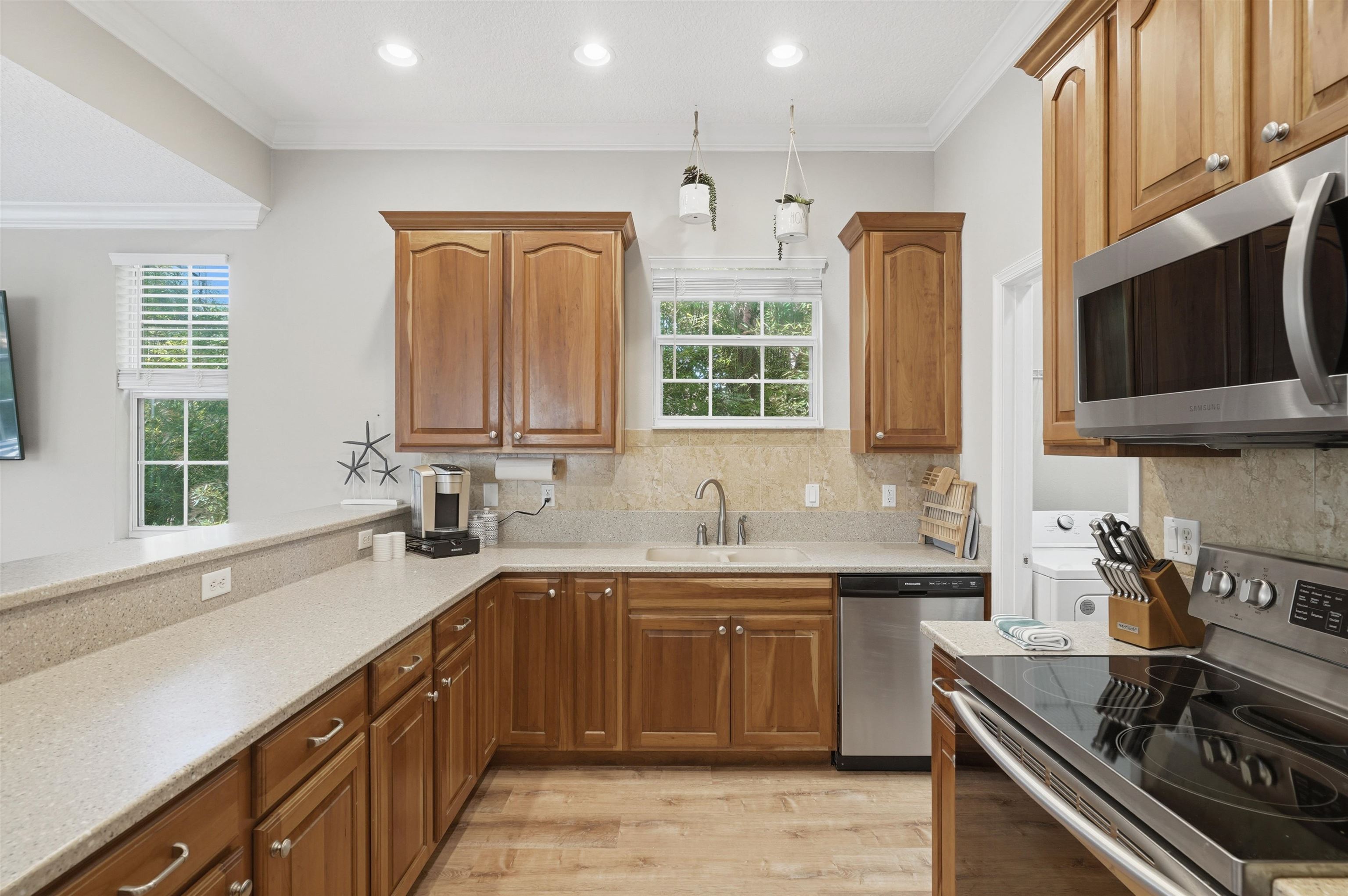 2 Lisbon Street St. Augustine, FL 32080 - Photo 13 of 39 a kitchen with a sink stove top oven and cabinets