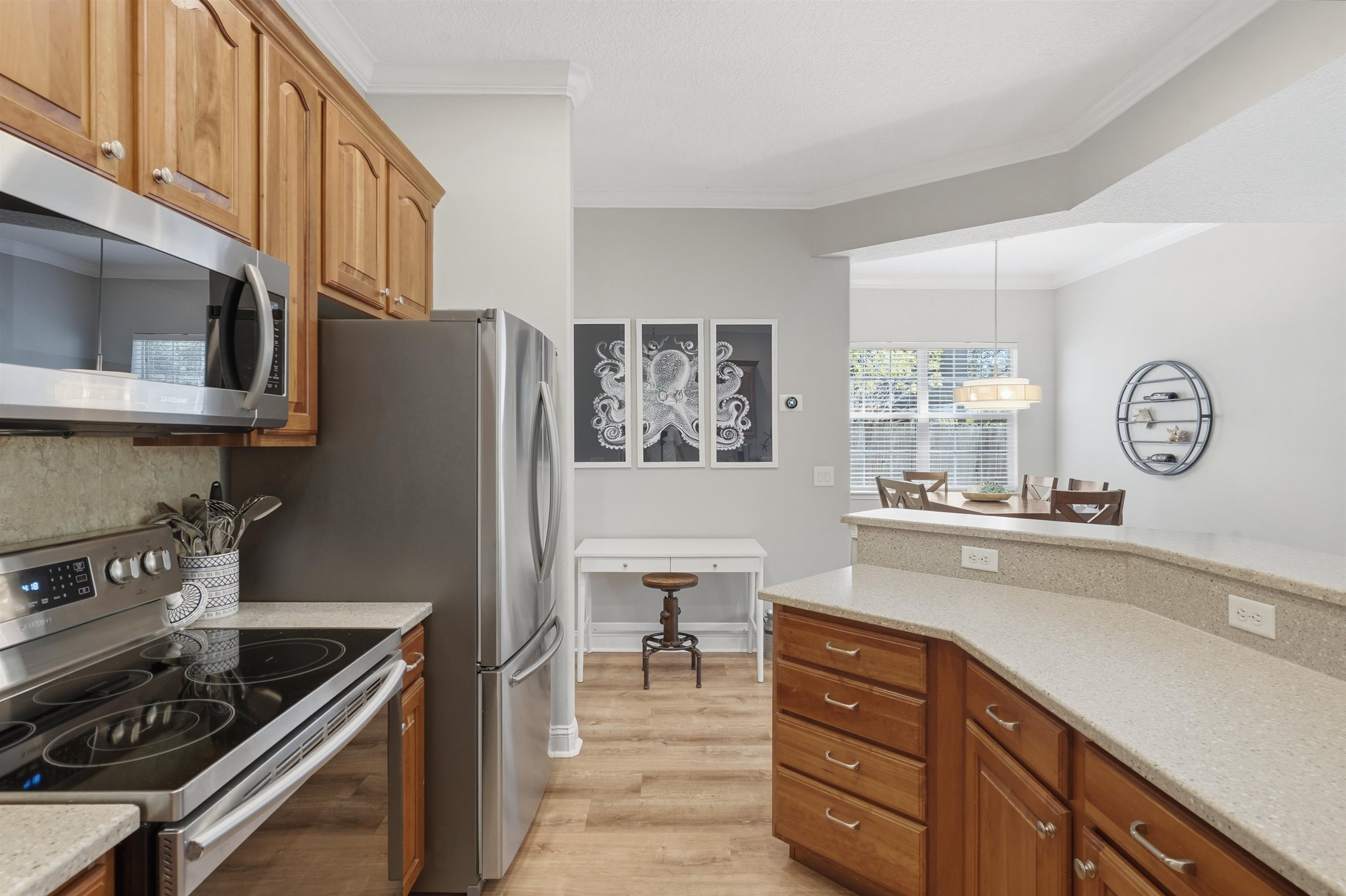 2 Lisbon Street St. Augustine, FL 32080 - Photo 14 of 39 a kitchen with stainless steel appliances granite countertop a stove and a sink