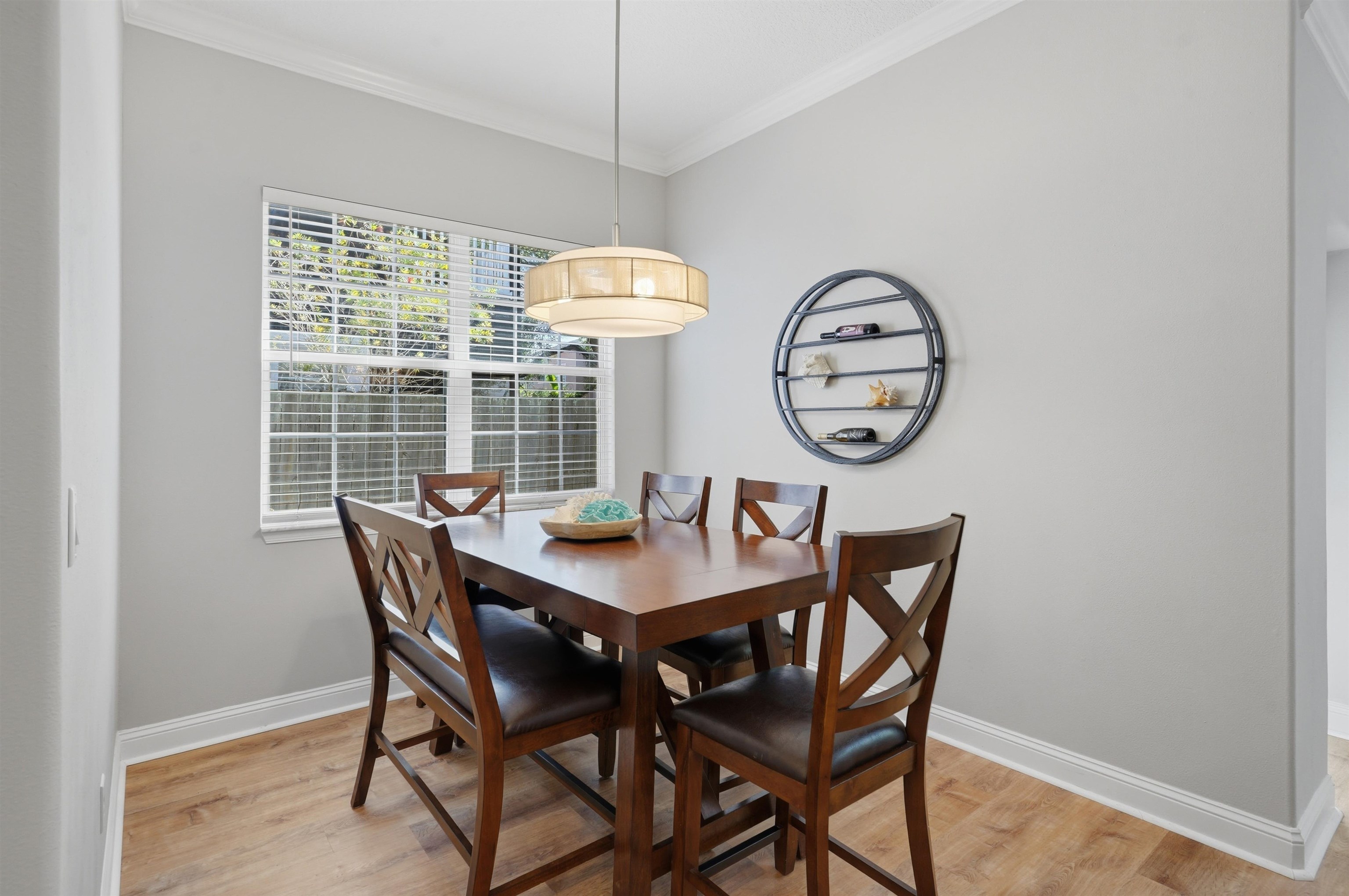 2 Lisbon Street St. Augustine, FL 32080 - Photo 16 of 39 a view of a dining room with furniture window and wooden floor
