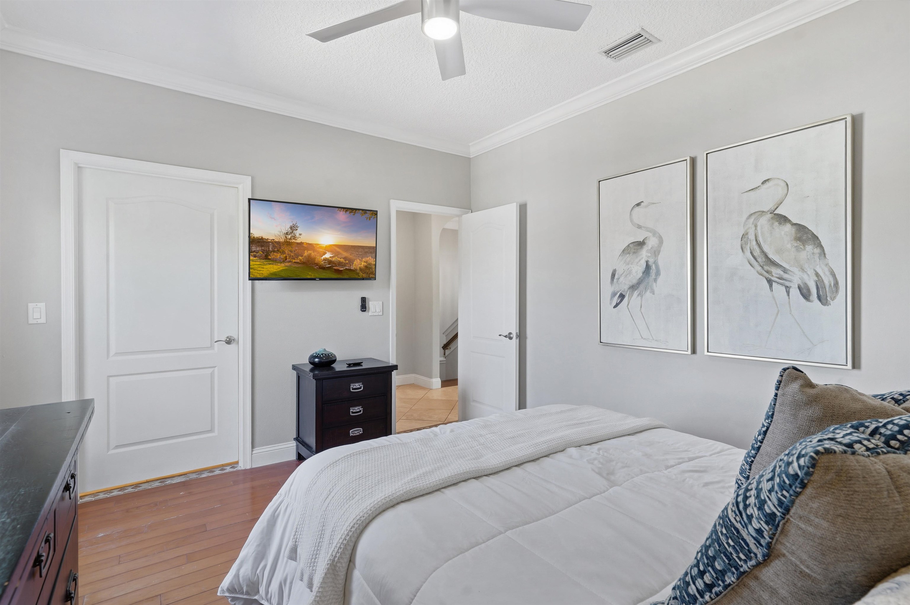 2 Lisbon Street St. Augustine, FL 32080 - Photo 19 of 39 a bedroom with a bed and a chandelier
