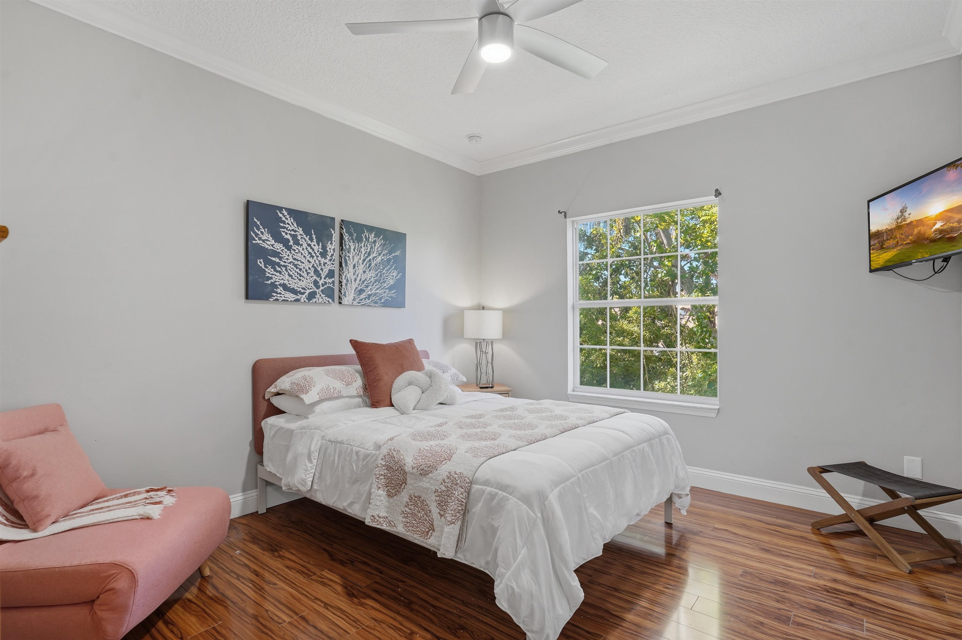 2 Lisbon Street St. Augustine, FL 32080 - Photo 21 of 39 a bedroom with a bed and wooden floor